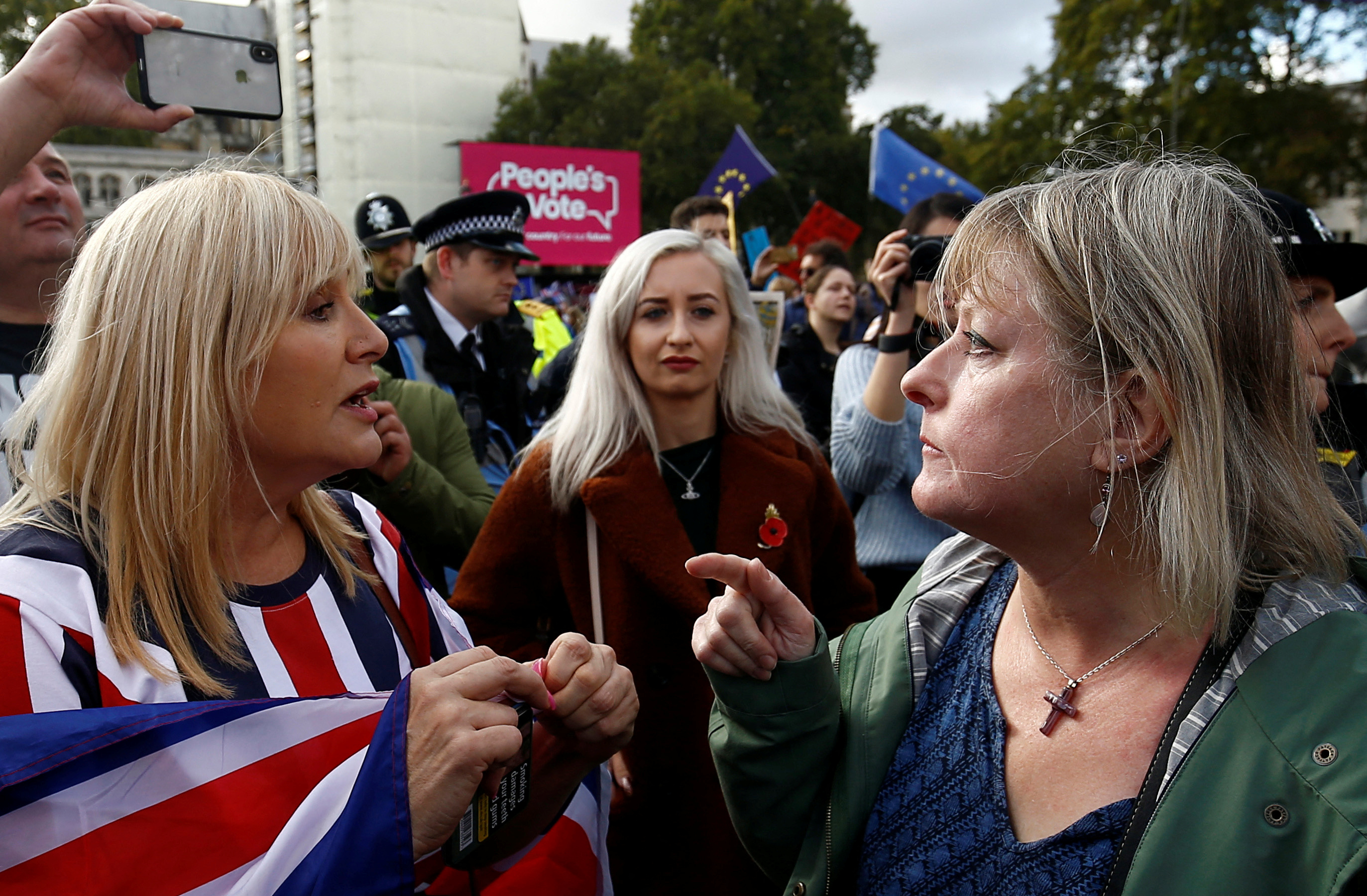 Pro-Brexit and anti-Brexit demonstrators argue at the Parliament Square as parliament sits on a Saturday for the first time since the 1982 Falklands War, to discuss Brexit in London, Britain, October 19, 2019. REUTERS/Henry Nicholls TPX IMAGES OF THE DAY
