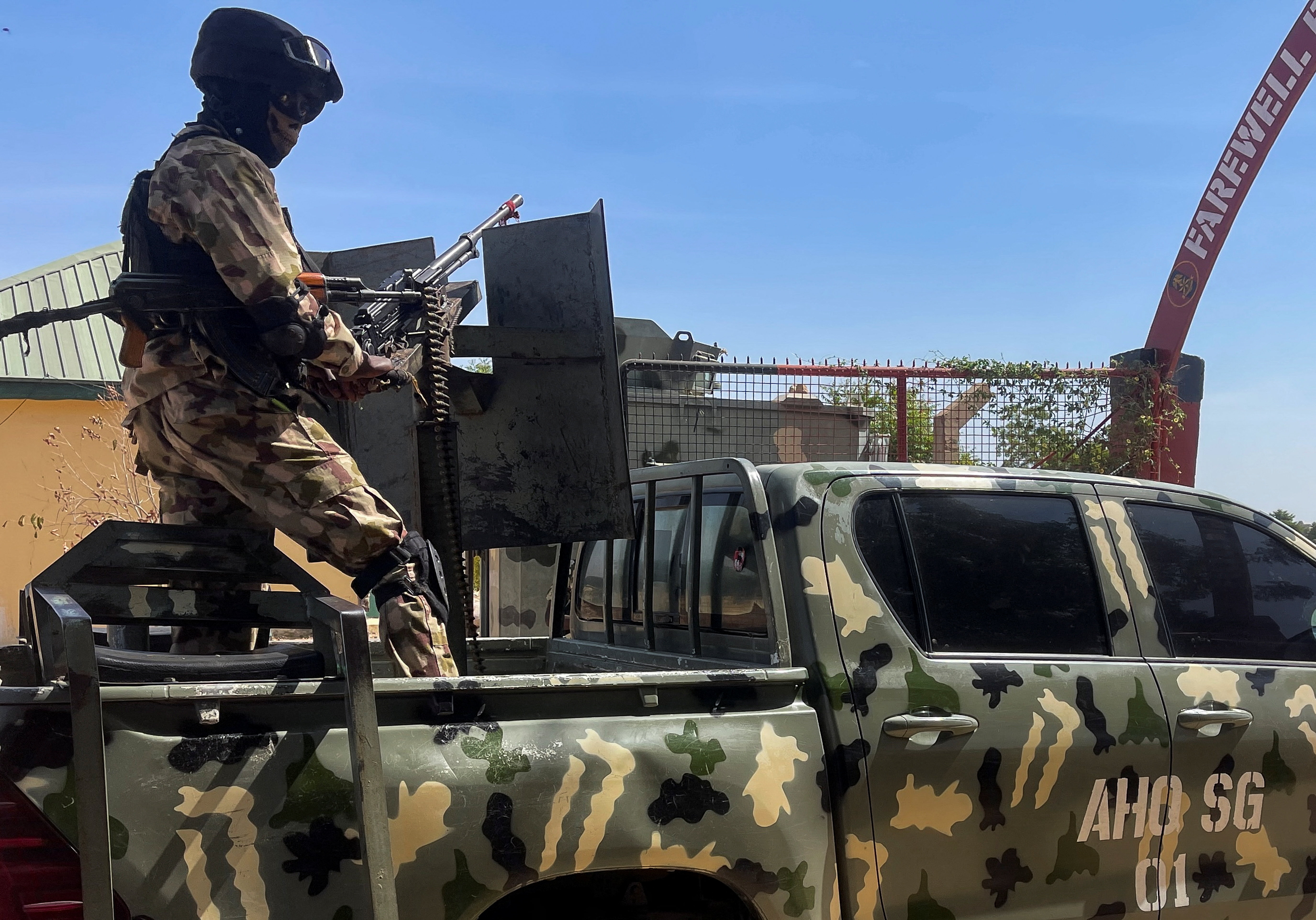 A Nigerian soldier stands on a military truck, during the tour of the Theatre Command Operation Lafiya Dole by Nigeria's Chief of Army Staff