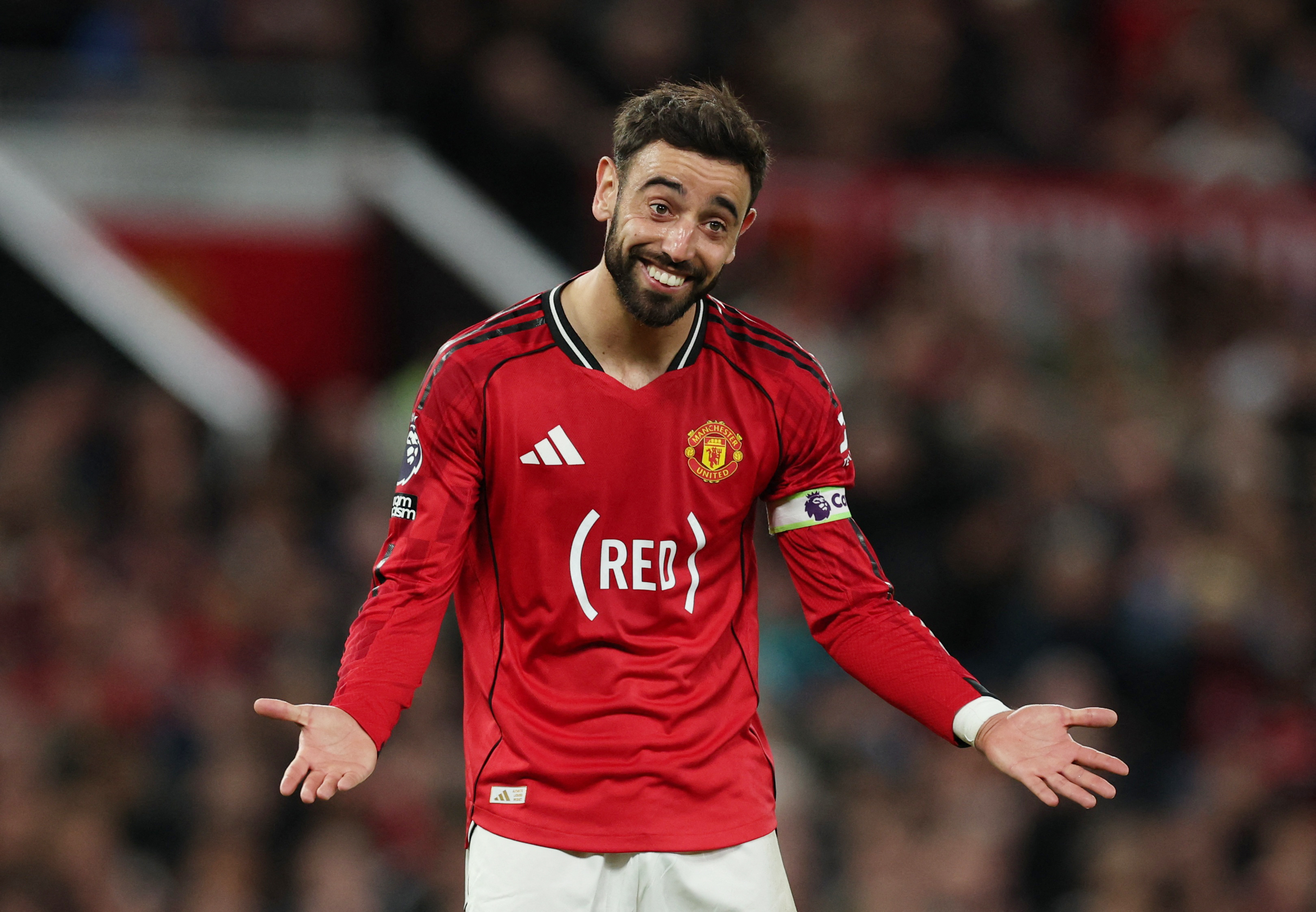 Manchester United's Bruno Fernandes smiles during a game.