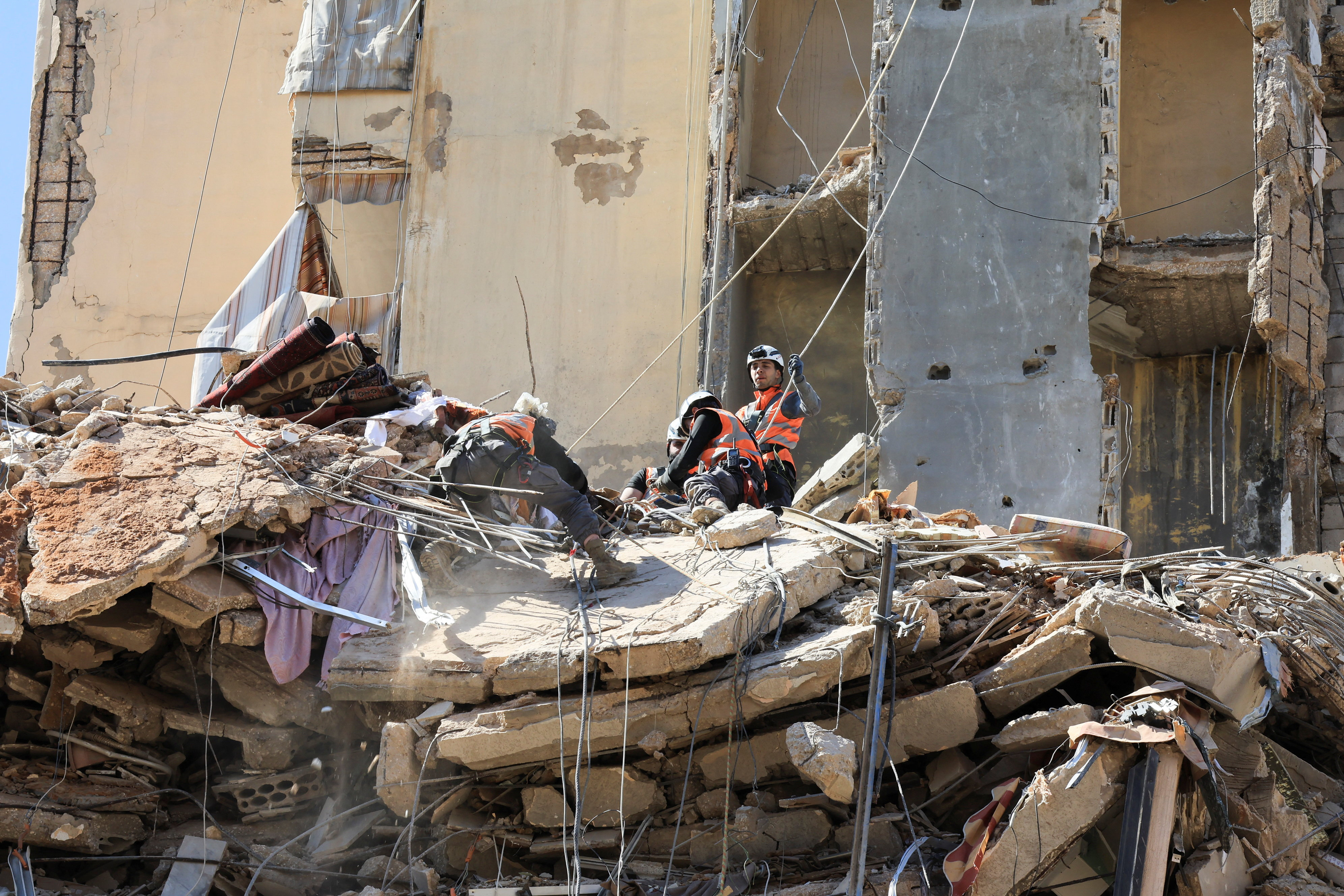 Rescuers work at the site of an Israeli strike