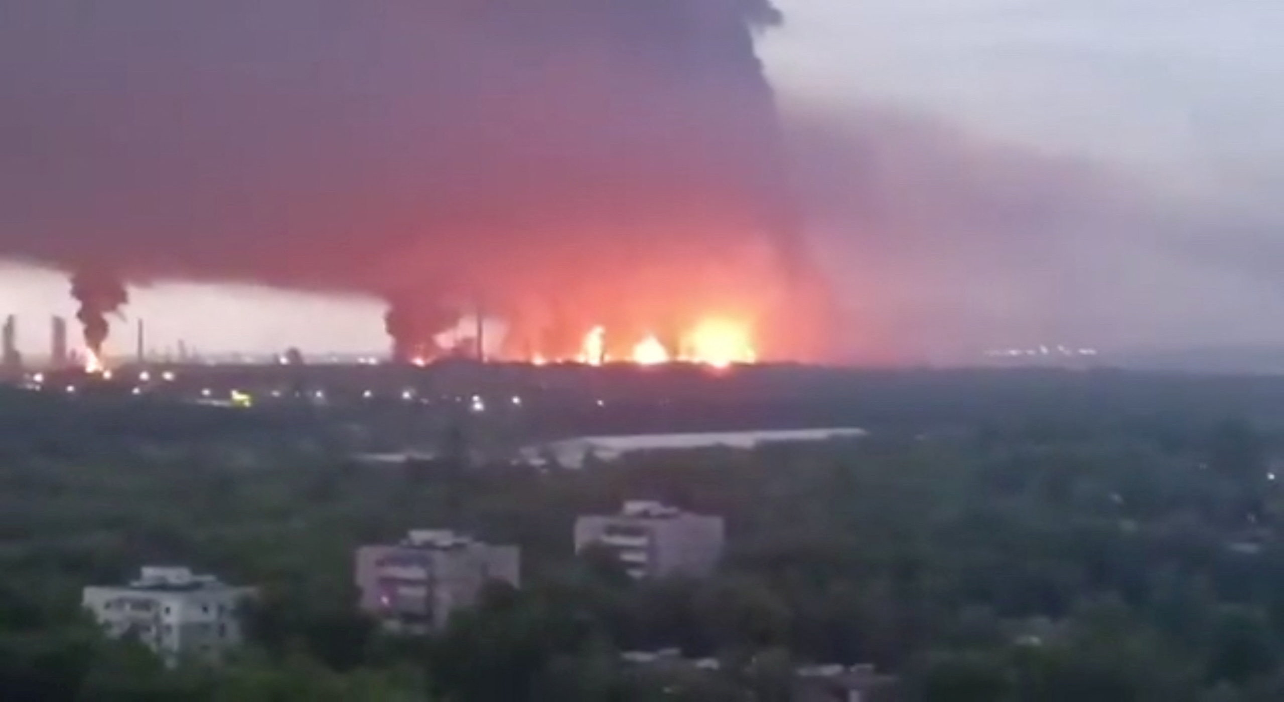 Fire and a plume of smoke rise in the vicinity of the Ryazan oil refinery, May 15, 2026. [Supplied via Reuters]