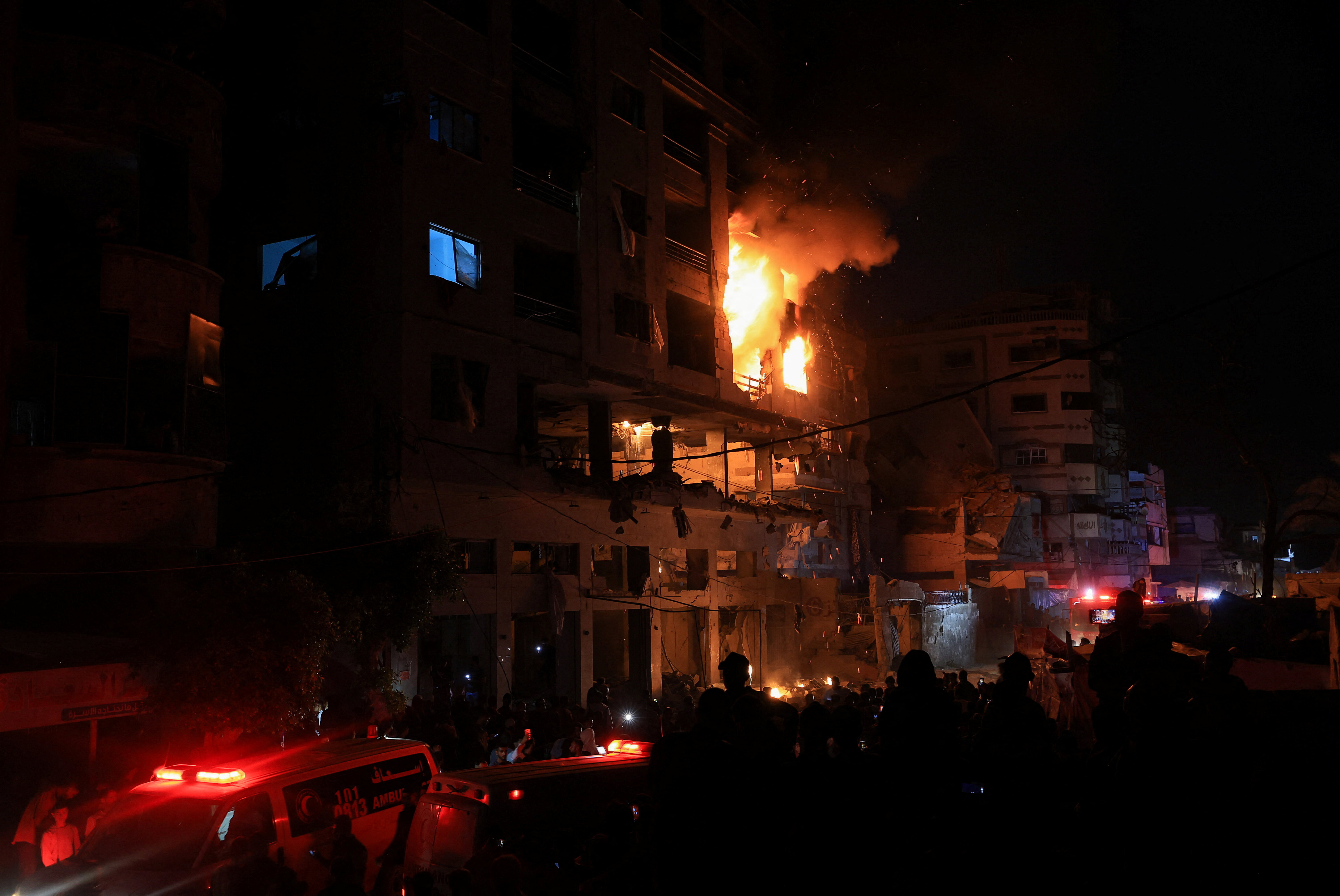 A fire burns in a residential apartment after Israeli shelling, according to the Ministry of Health