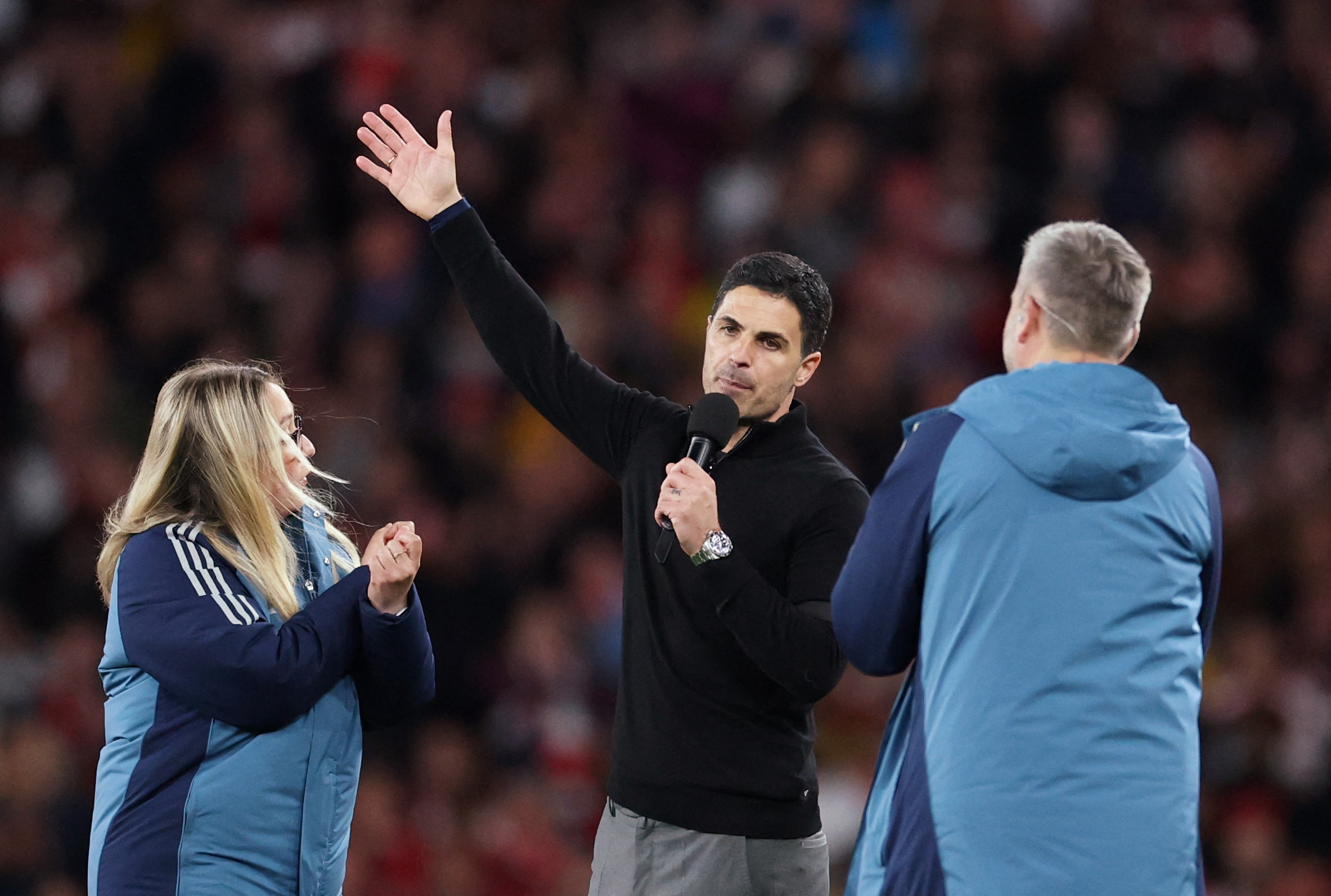 Arsenal manager Mikel Arteta talks to fans after the match