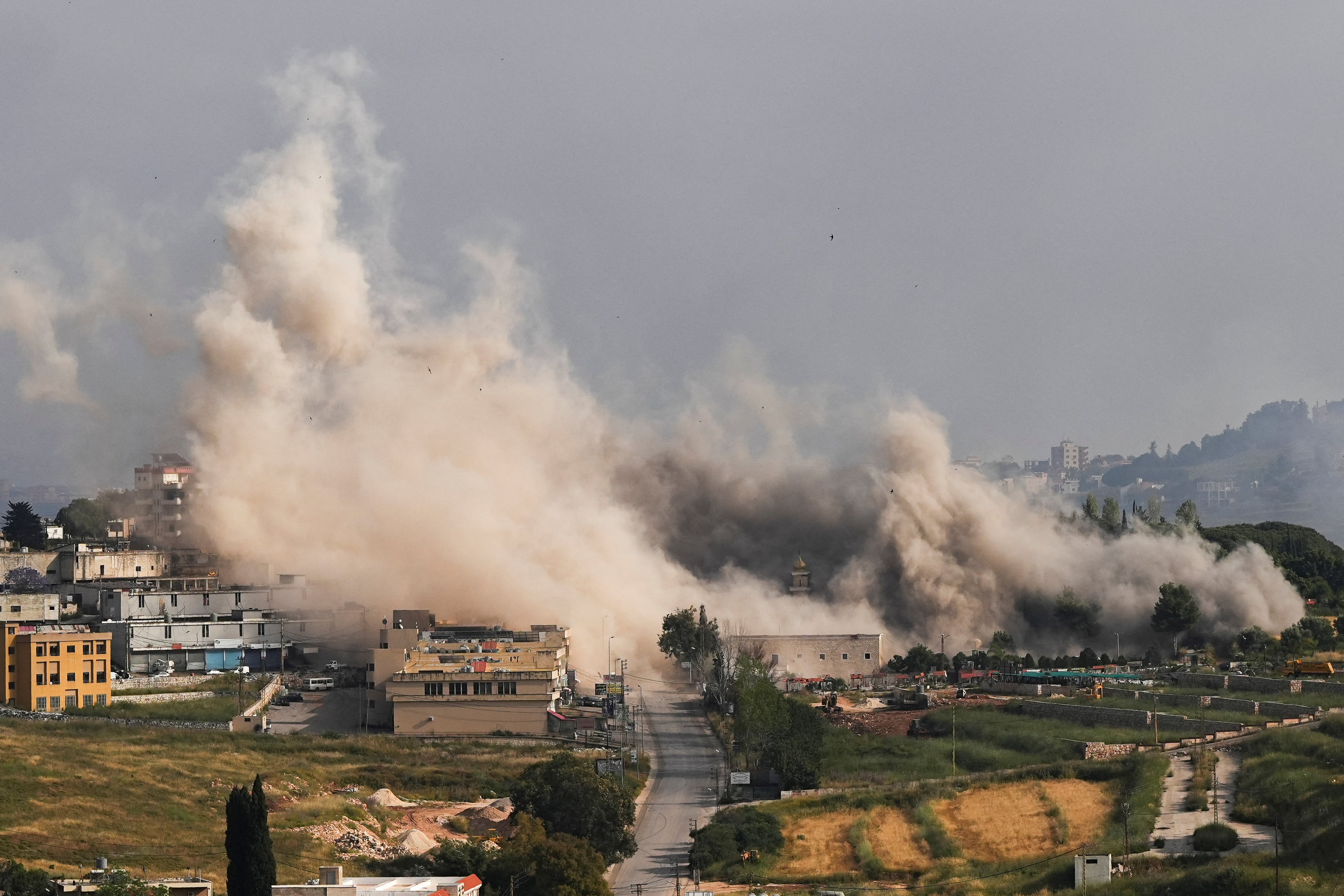 Smoke billows following an Israeli strike in Nabatieh