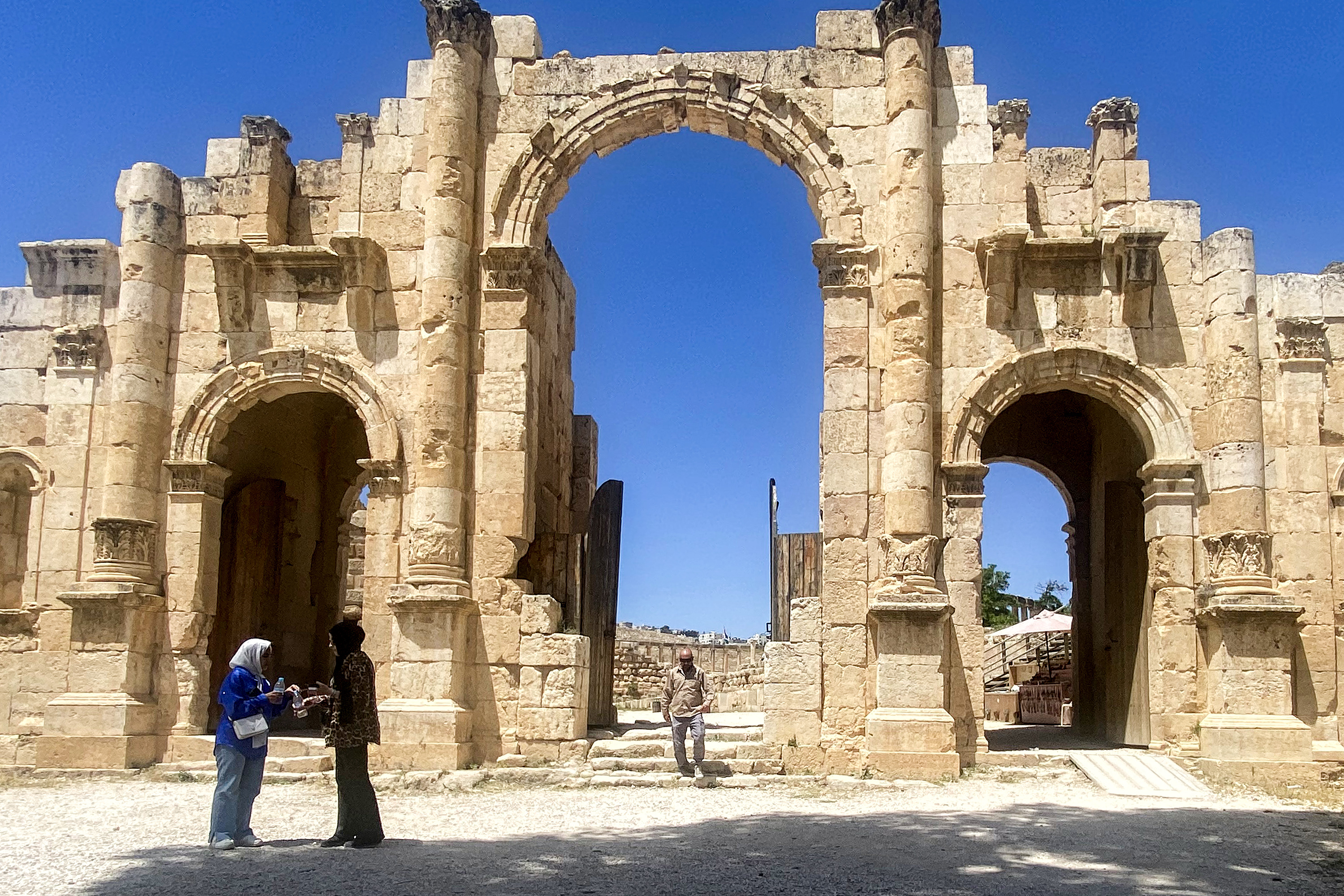 Tourists visit the Treasury in the ruins of the ancient Nabatean city of Petra