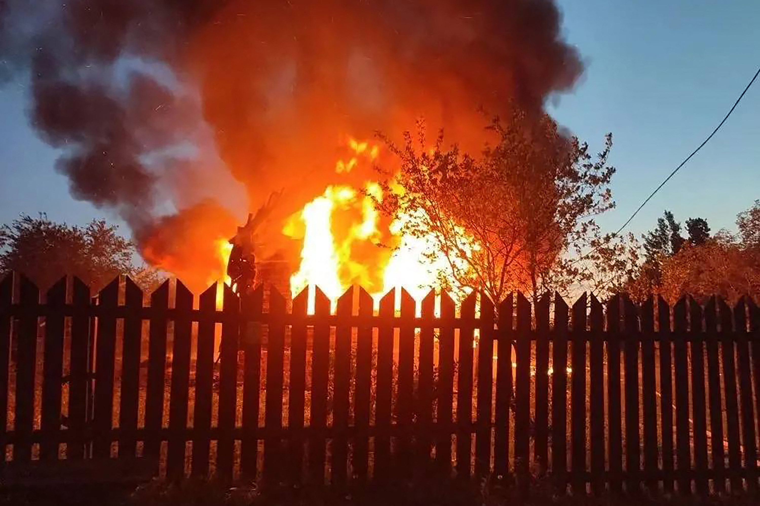 This handout photograph posted on the official Telegram channel of Moscow Region Governor Andrey Vorobyov on May 17, 2026 shows a burning building following an air attack at an undisclosed location in the Moscow region, amid the ongoing Russian-Ukrainian conflict. A huge wave of more than 500 Ukrainian drones attacked Russia overnight, killing three people in the Moscow region, authorities said on May, 17, 2026. Air defences shot down 556 drones in more than a dozen regions, including Moscow, Russia's defence ministry said, in one of the largest Ukrainian barrages of the ongoing conflict so far. [Handout/TELEGRAM/@vorobiev_live/AFP]