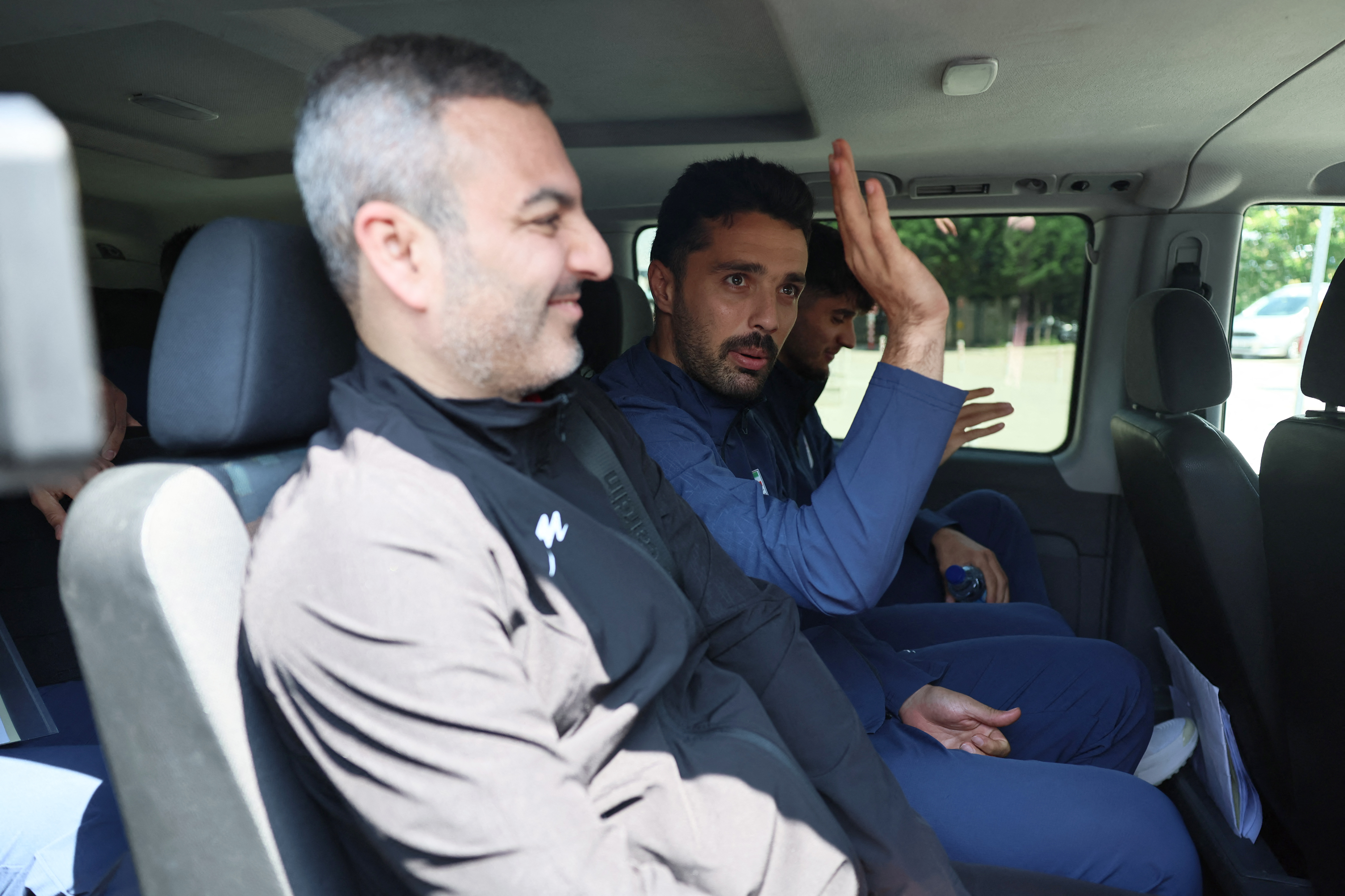 Iran's national football team players and members of their delegation leave the US Embassy in Ankara after submitting their visa applications ahead of the 2026 FIFA World Cup, on May 21, 2026. The Iranian football federation vice-president said on May 20, 2026 he was "very confident" in FIFA's protocols as the team prepare to play at the World Cup in the United States. The players are to stay several weeks before heading to the World Cup that is being co-hosted by the US, which began bombing Iran on February 28 alongside Israel, sparking a wider war in the Middle East. (Photo by Adem ALTAN / AFP)