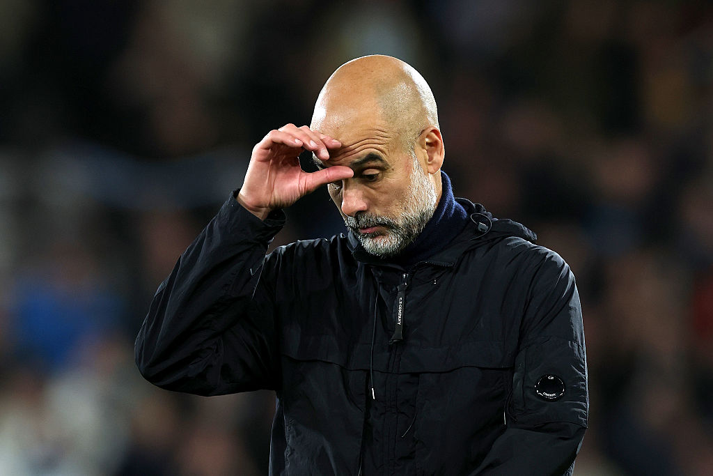 Pep Guardiola, Manager of Manchester City, appears dejected following the Premier League match between Bournemouth and Manchester City