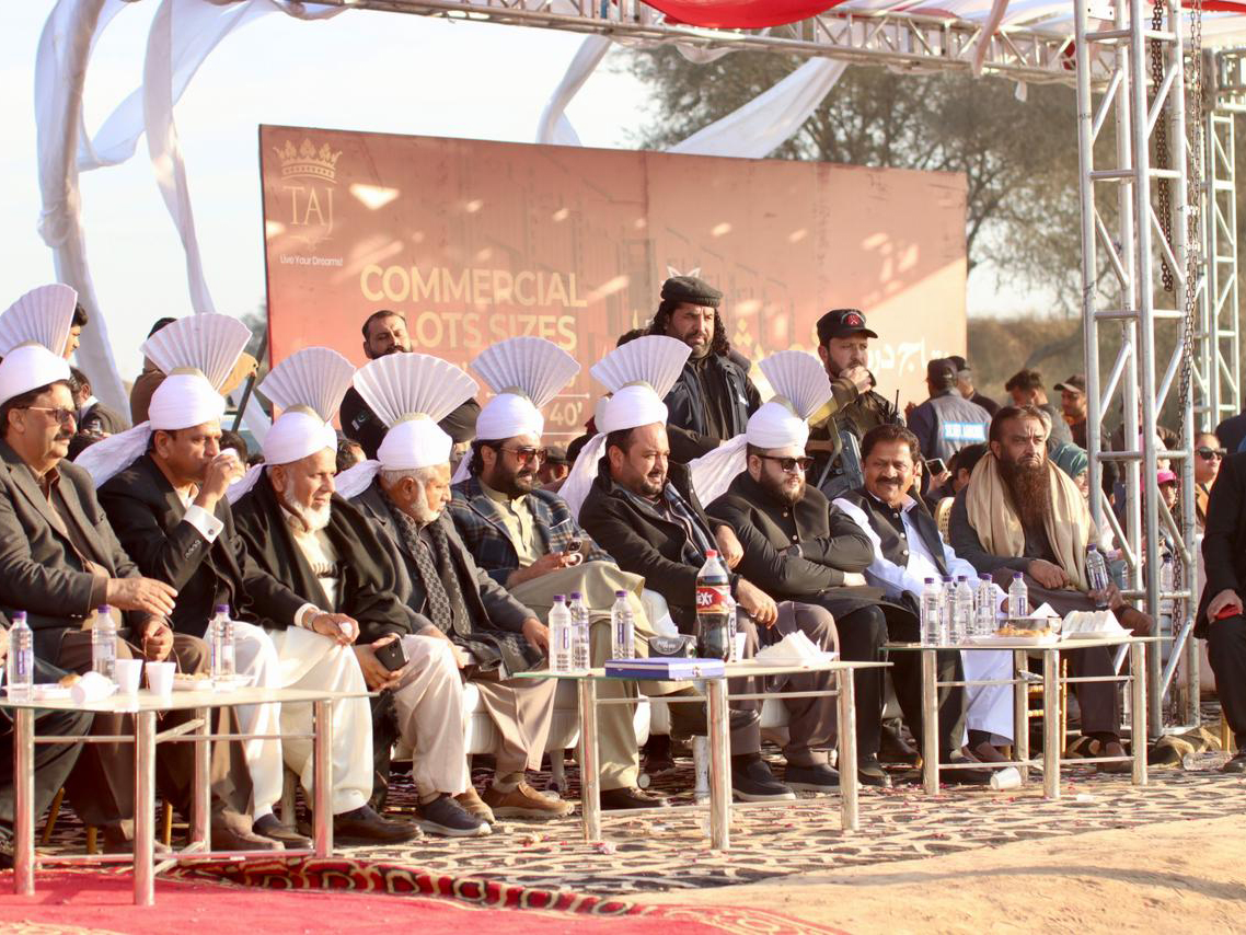 Local political and feudal elites wearing honorary turbans look on as a tent pegging event kicks off [Mutee Ur Rehman/Al Jazeera]