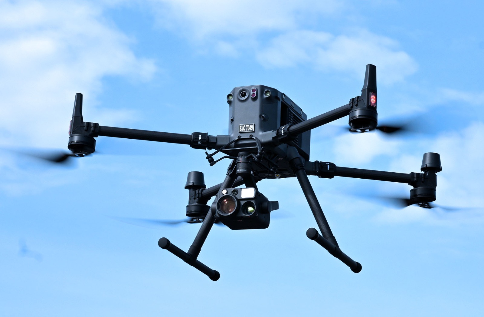A drone hovers in the air