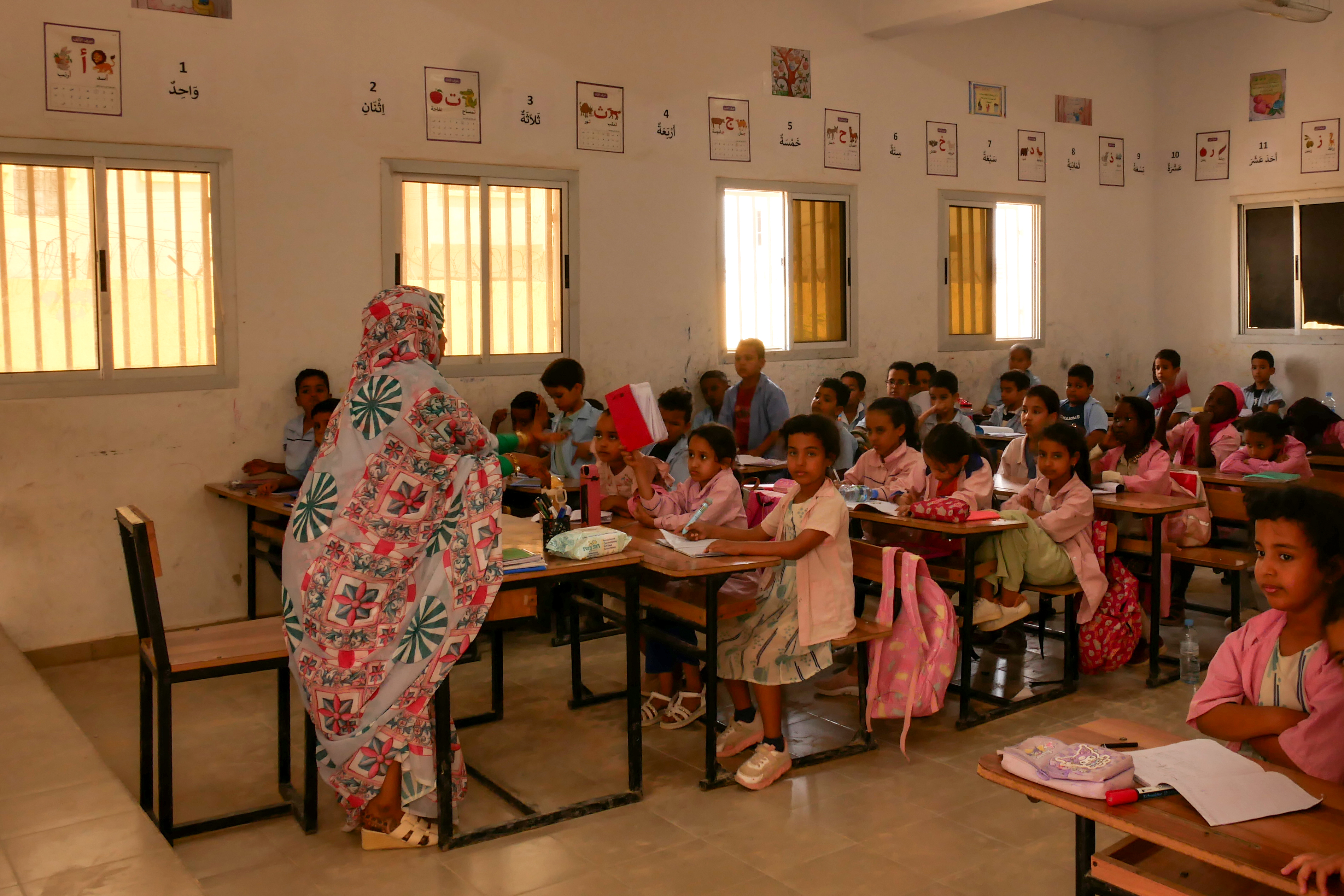 A teacher speaks to students in a Mauritania school