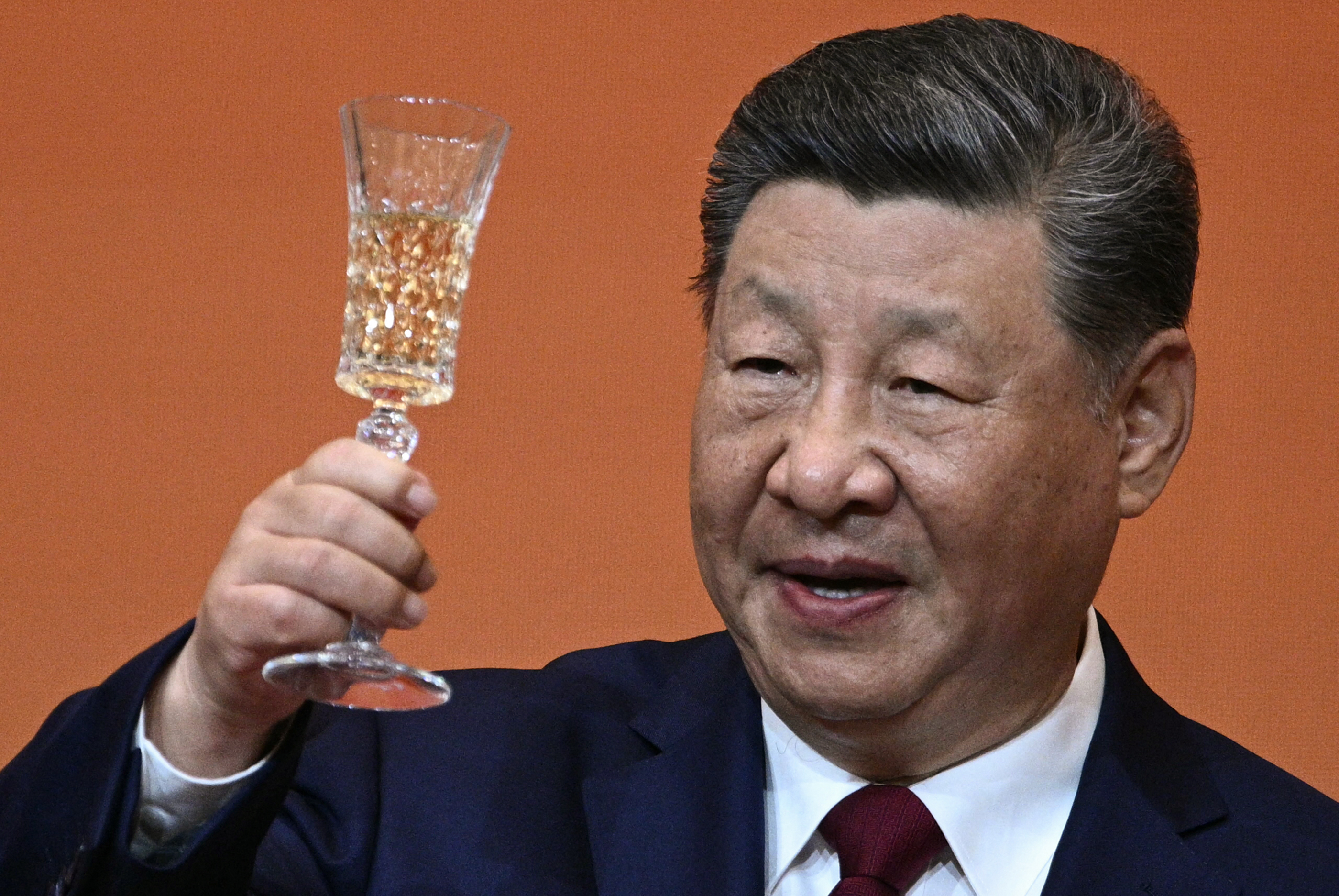 China's President Xi Jinping makes a toast during a state banquet for US President Donald Trump at the Great Hall of the People in Beijing on May 14, 2026. (Photo by Brendan SMIALOWSKI / AFP)
