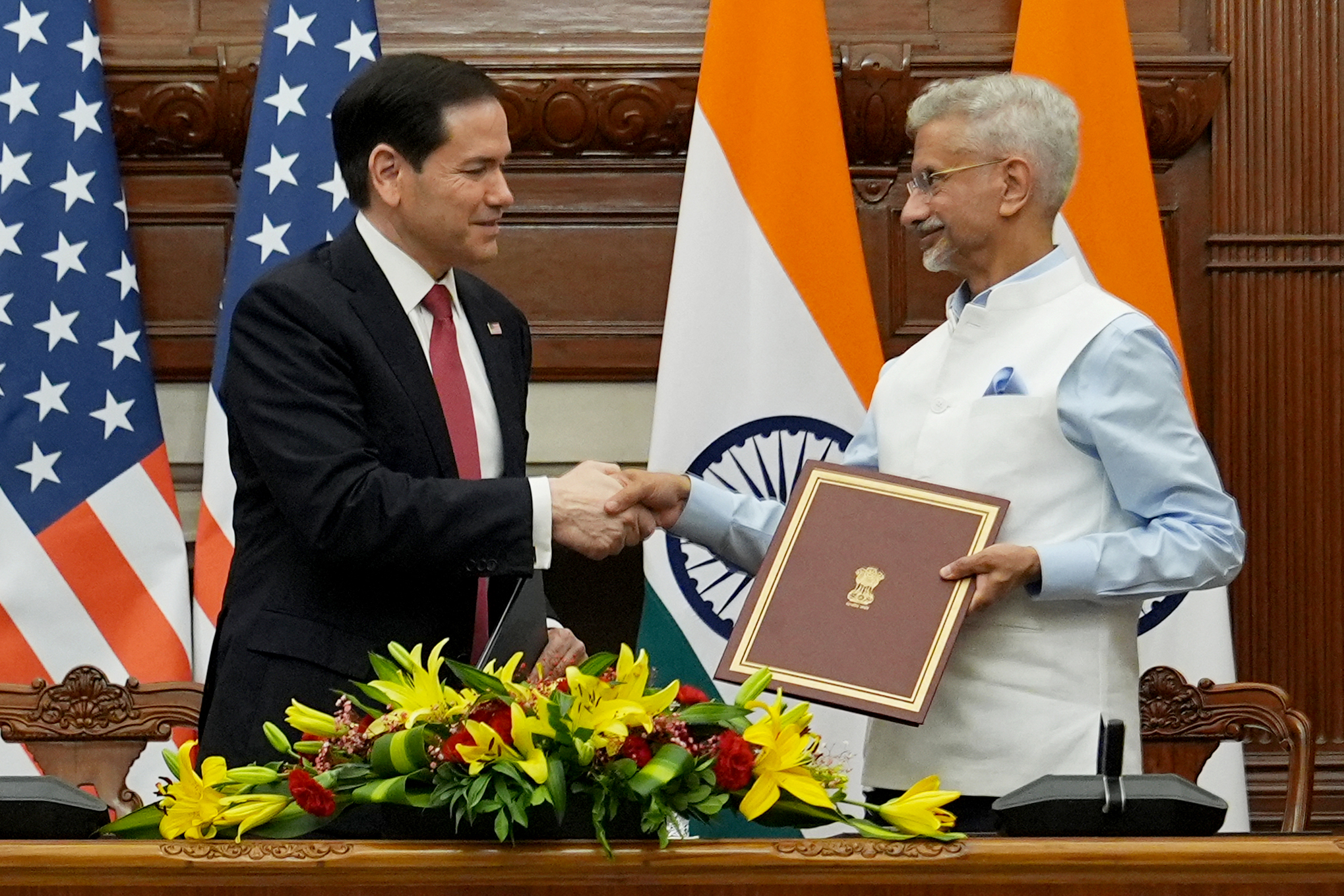 US Secretary of State Marco Rubio (L) and India's Foreign Minister Subrahmanyam Jaishankar shakes hands after signing a memorandum of understanding (MoU) at the Hyderabad House in New Delhi on May 26, 2026.