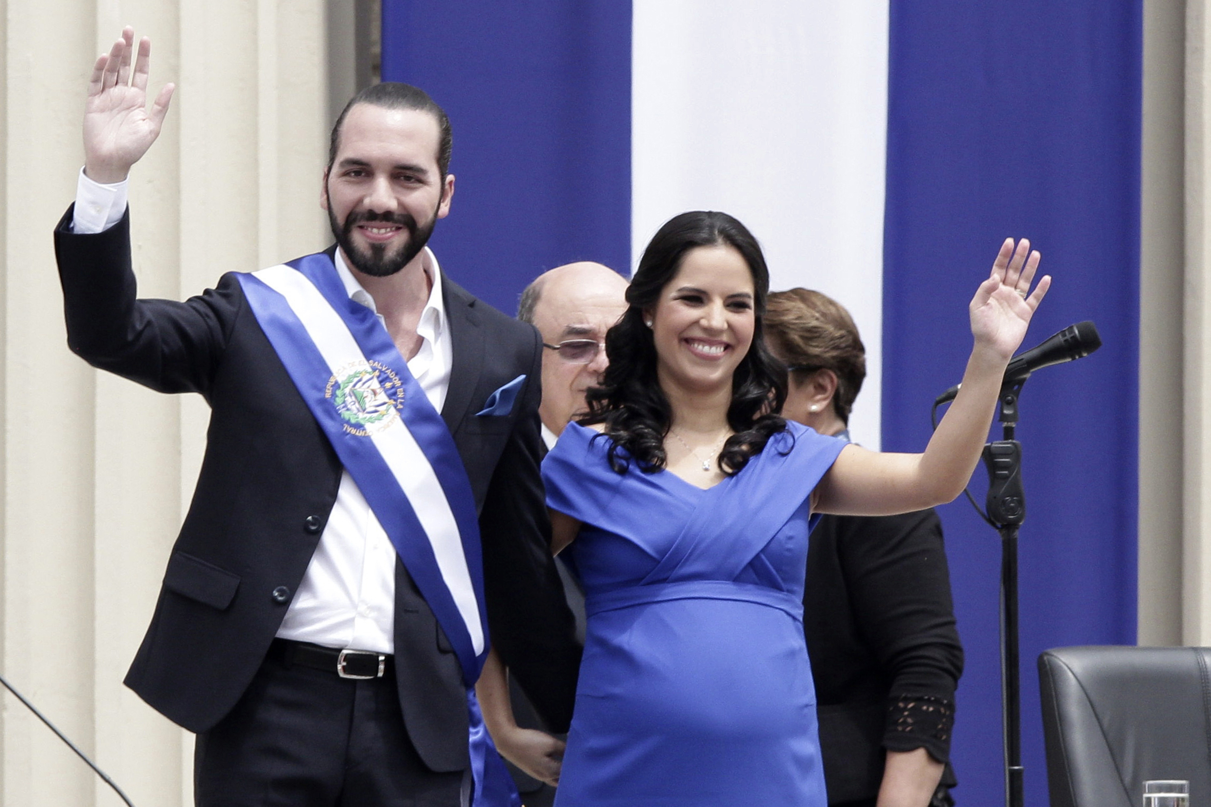 Nayib Bukele and his wife, Gabriela Rodríguez de Bukele, wave during his inauguration in San Salvador on June 1, 2019, after his election as one of Latin America’s youngest leaders.