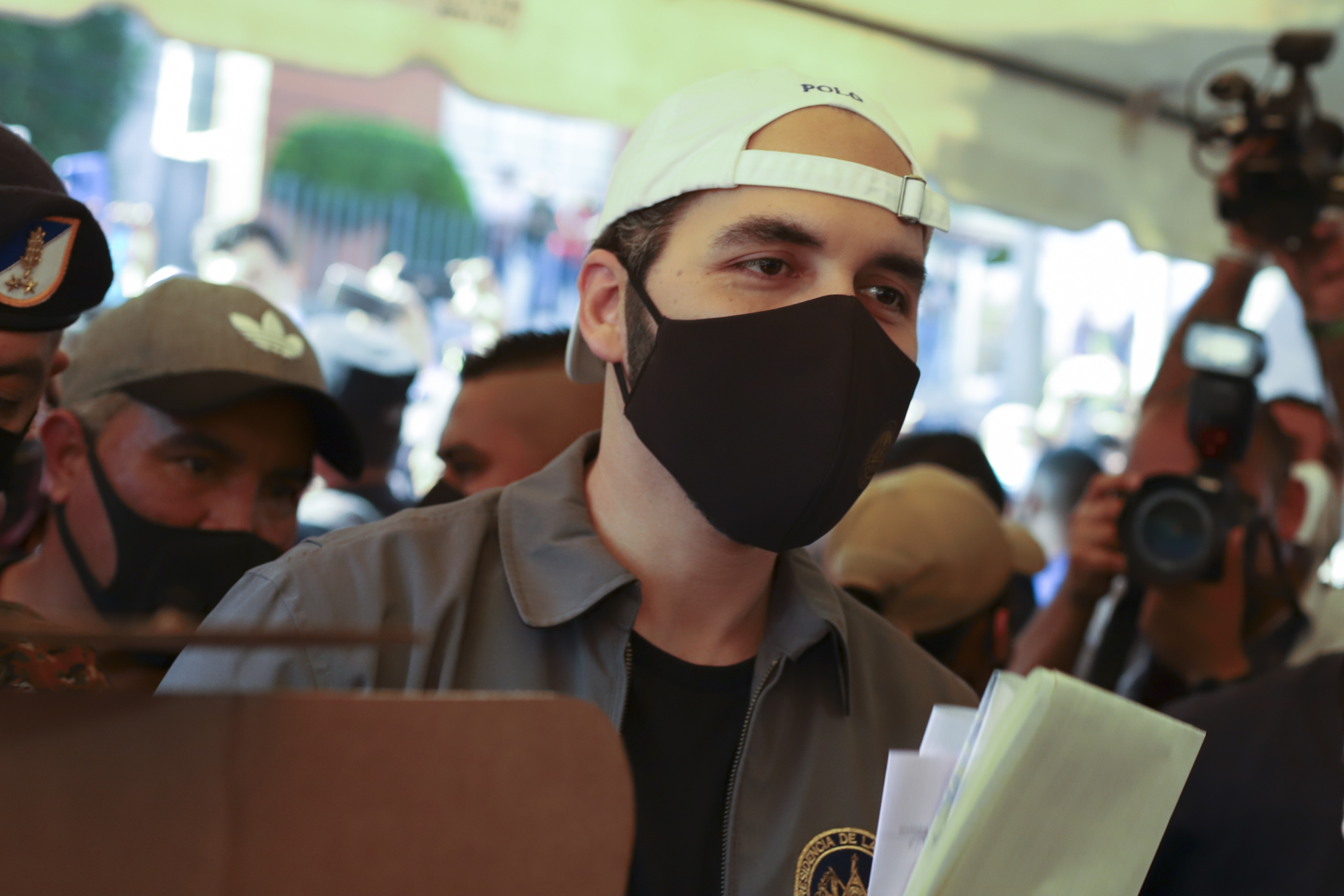 Nayib Bukele votes in San Salvador in 2021, amid strict pandemic controls introduced by his government.