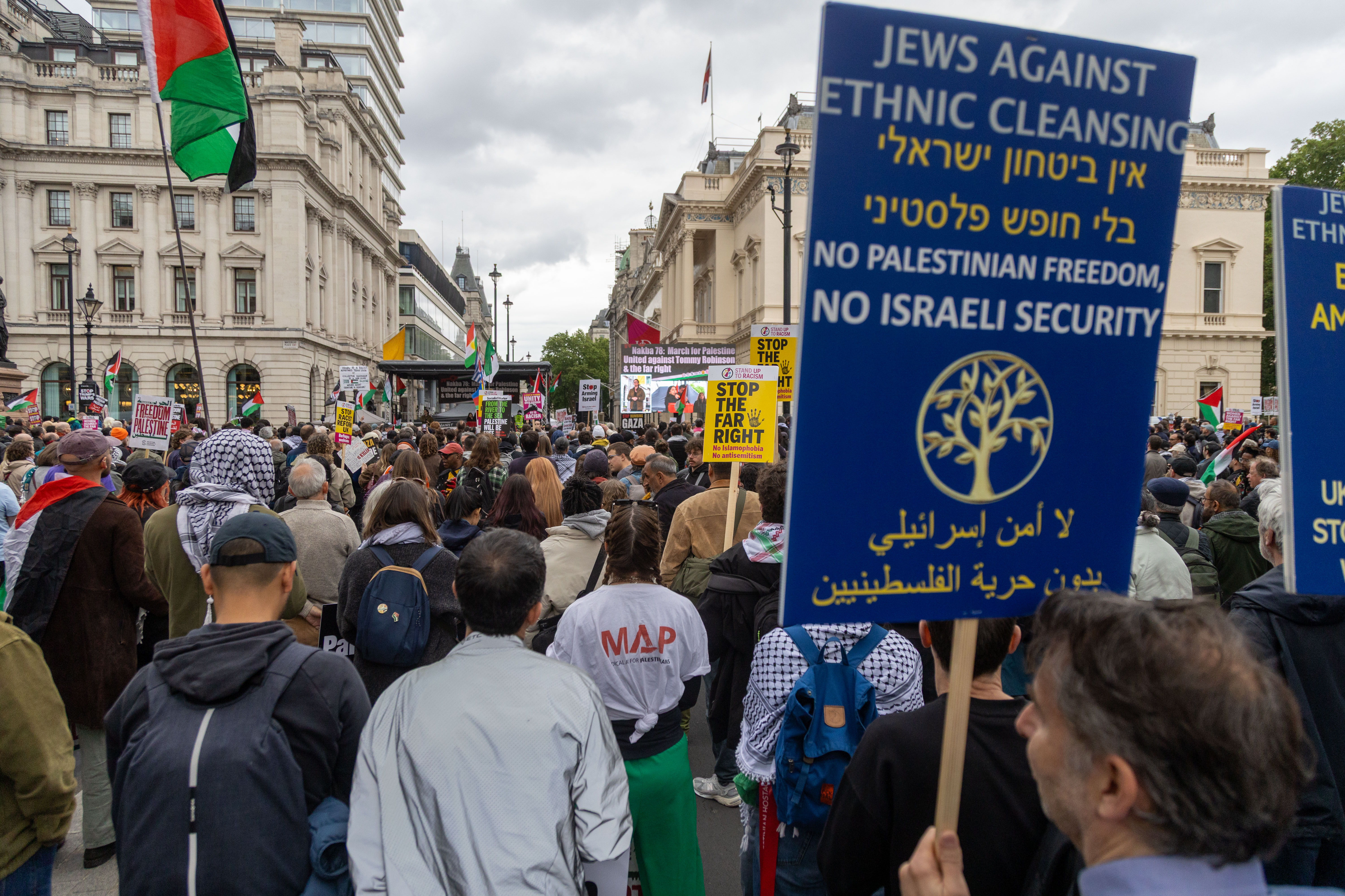 epa12964494 A protestor holds up a placard which says: 'Jews Against Ethnic Cleansing' during a march in support of Nakba 78: March for Palestine – United against Tommy Robinson and the far right in London, Britain, 16 May 2026. The Nakba march, which is Arabic for "catastrophe," refers to the mass displacement of Palestinians in 1948 around the founding of Israel and 2026 marks its 78th anniversary. The protest is taking place at the same time as a 'Unite the Kingdom' protest in central London. EPA/TAYFUN SALCI