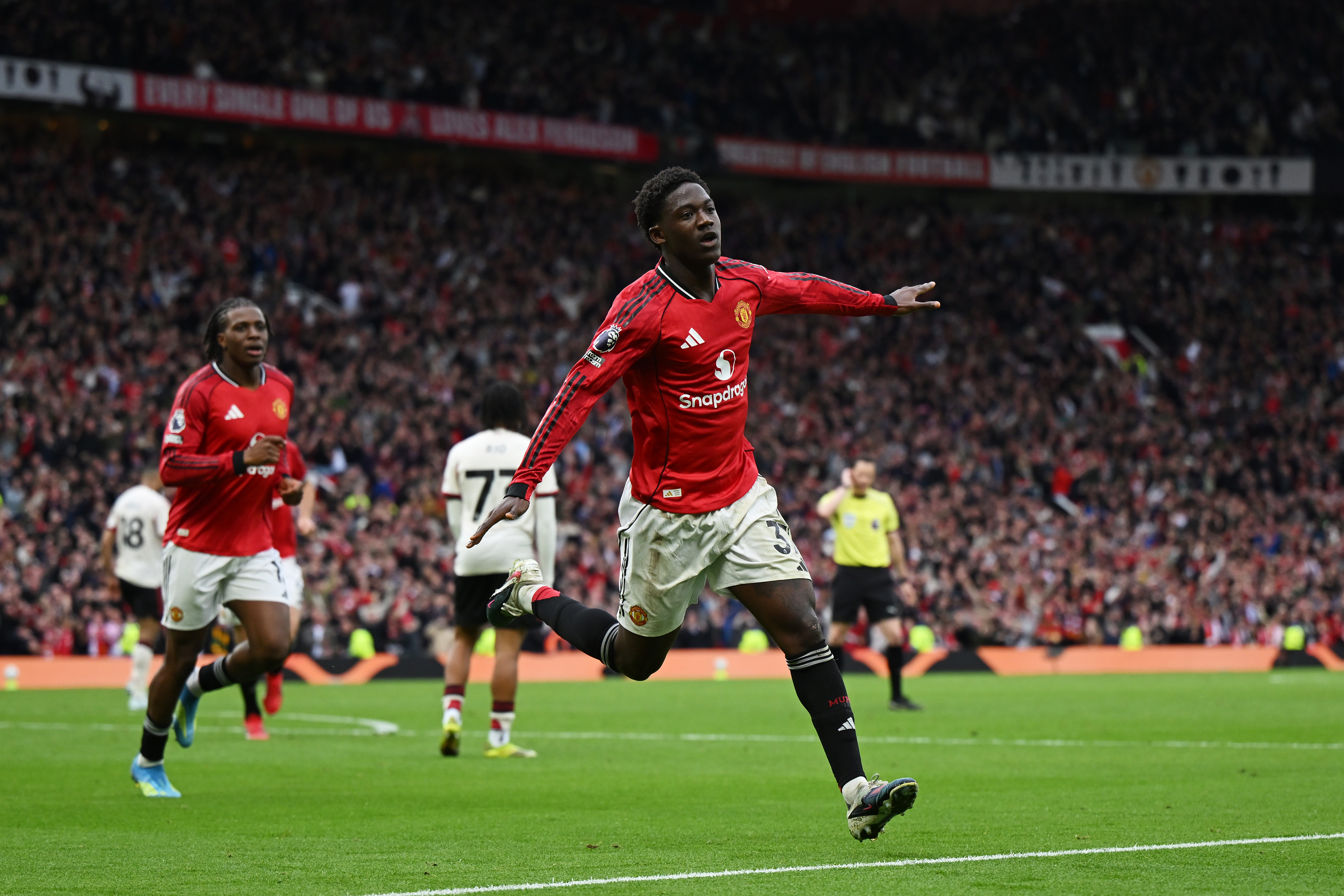 MANCHESTER, ENGLAND - MAY 03: Kobbie Mainoo of Manchester United celebrates scoring his team's third goal during the Premier League match between Manchester United and Liverpool at Old Trafford on May 03, 2026 in Manchester, England. (Photo by Shaun Botterill/Getty Images)