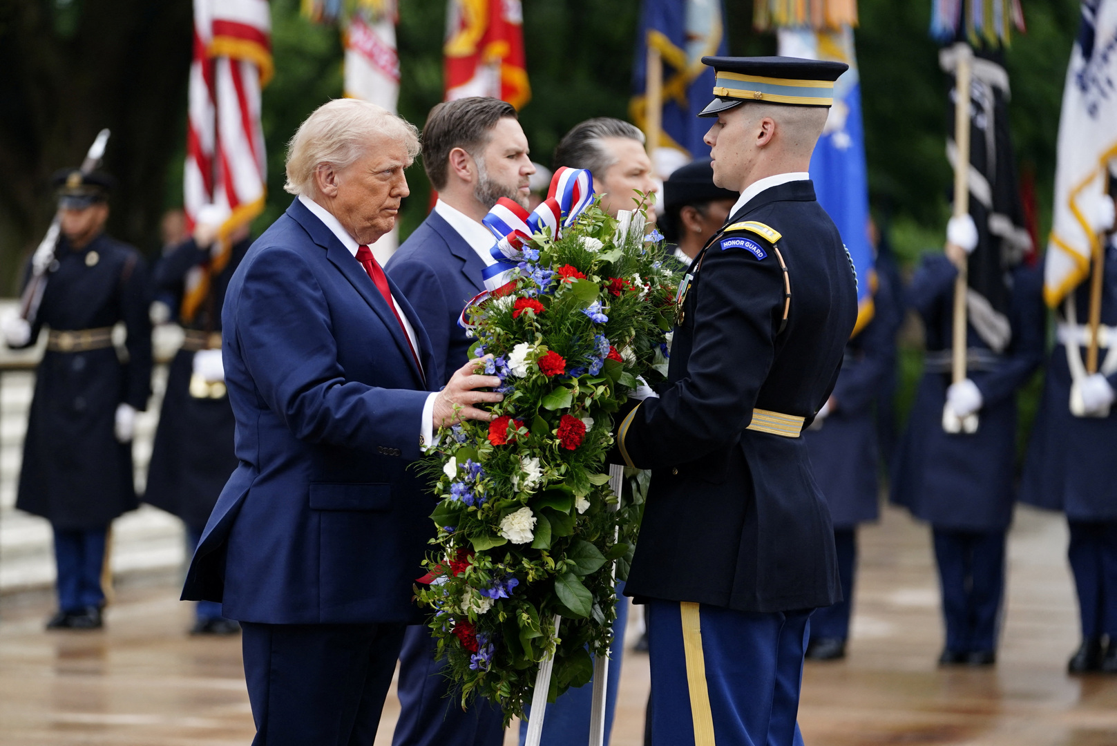 US President Donald Trump, US Vice President JD Vance and US Secretary of Defense Pete Hegseth participate in a wreath-laying ceremony at the Tomb of the Unknown Soldier as part of a Memorial Day event at Arlington National Cemetery, Arlington, Virginia, US on May 25, 2026. [Nathan Howard/Reuters]
