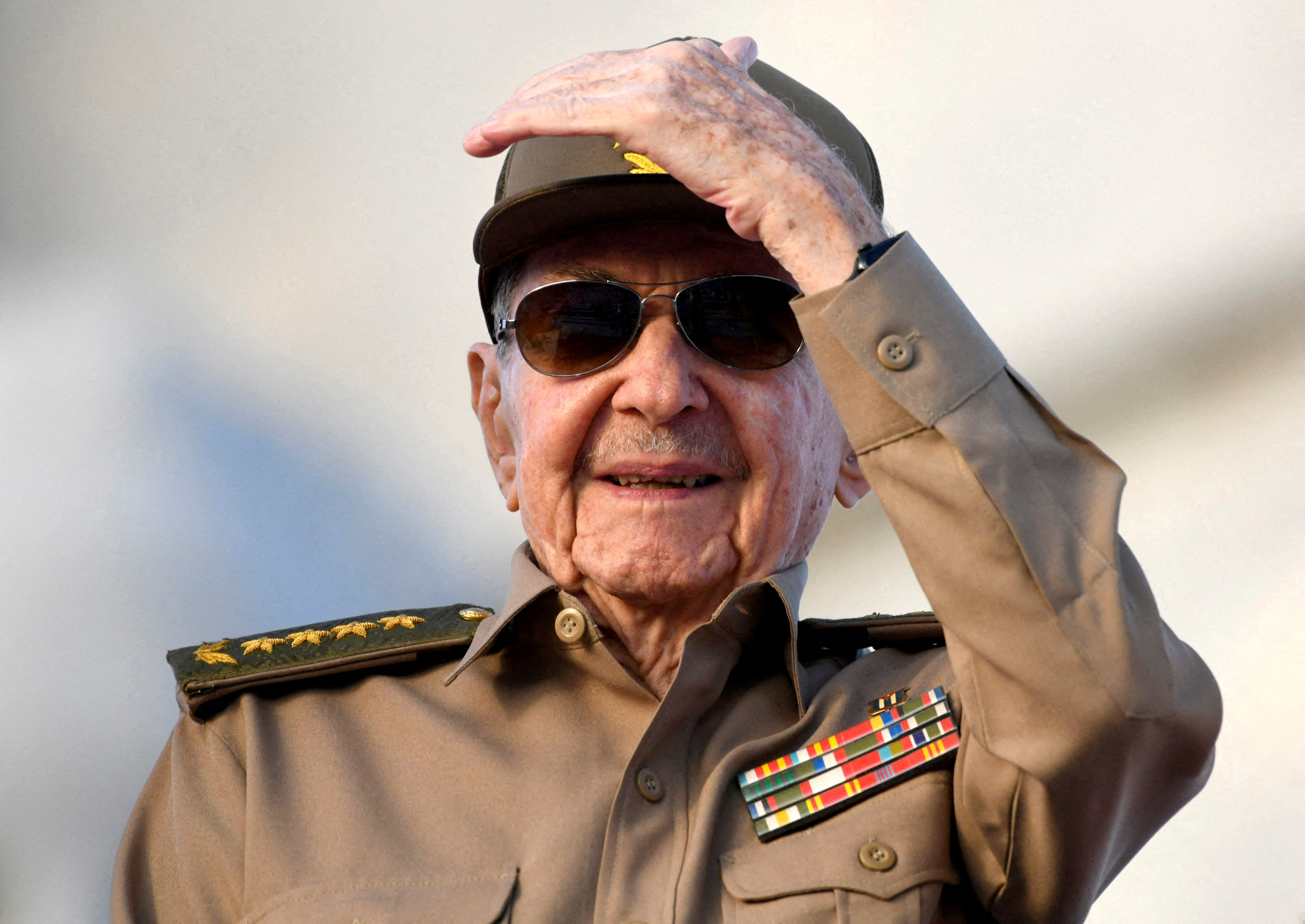 Cuba's former President Raul Castro watches a rally.