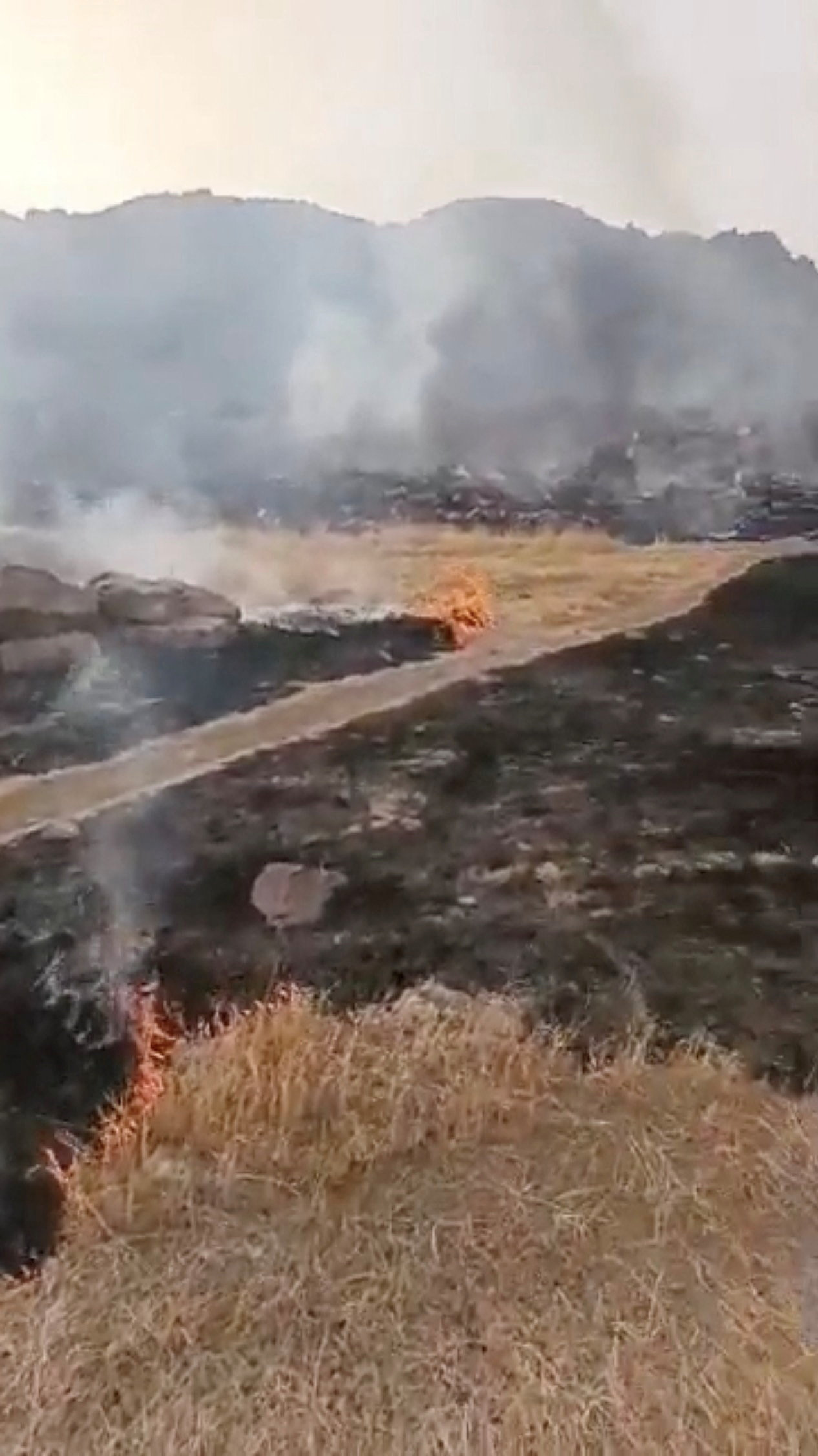 Smoke rises amid burned areas at a military base in Hombori, Mali, in this still image obtained from an undated social media video released April 30, 2026. Al Qaeda affiliate Jama'at Nusrat al-Islam wal-Muslimin (JNIM) said on Thursday it had captured the military base of Hombori. Social media via REUTERS THIS IMAGE HAS BEEN SUPPLIED BY A THIRD PARTY. NO RESALES. NO ARCHIVES. NEWS USE ONLY VERIFICATION: Reuters verified the location from the gates, buildings, barrier and mountains seen in the video, which matched archive and satellite imagery from the area. Location of barracks: 15.2683393634622, -1.7728507348021563. The date when the video was recorded could not be verified, but no older versions of the video were found posted online before April 30. Rebel group JNIM also made a statement on April 30 claiming control of the Hombori military barracks seen in the video. Corroborating video was also posted on April 30 showing the same scene and mountains.