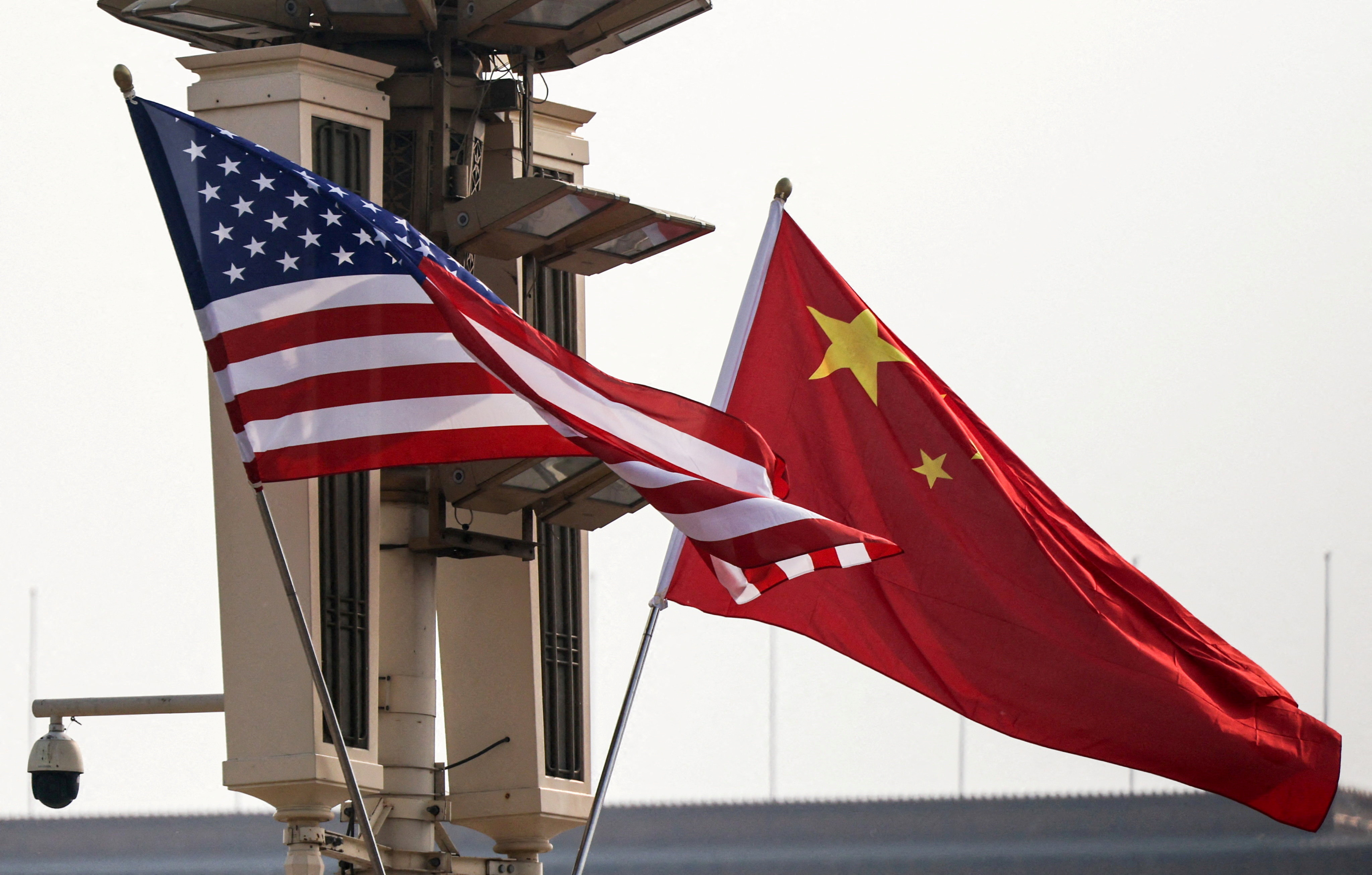 FILE PHOTO: U.S. and China’s national flags flutter in Tiananmen Square, ahead of U.S. President Donald Trump's visit to China, in Beijing, China, May 13, 2026. REUTERS/Maxim Shemetov/File Photo