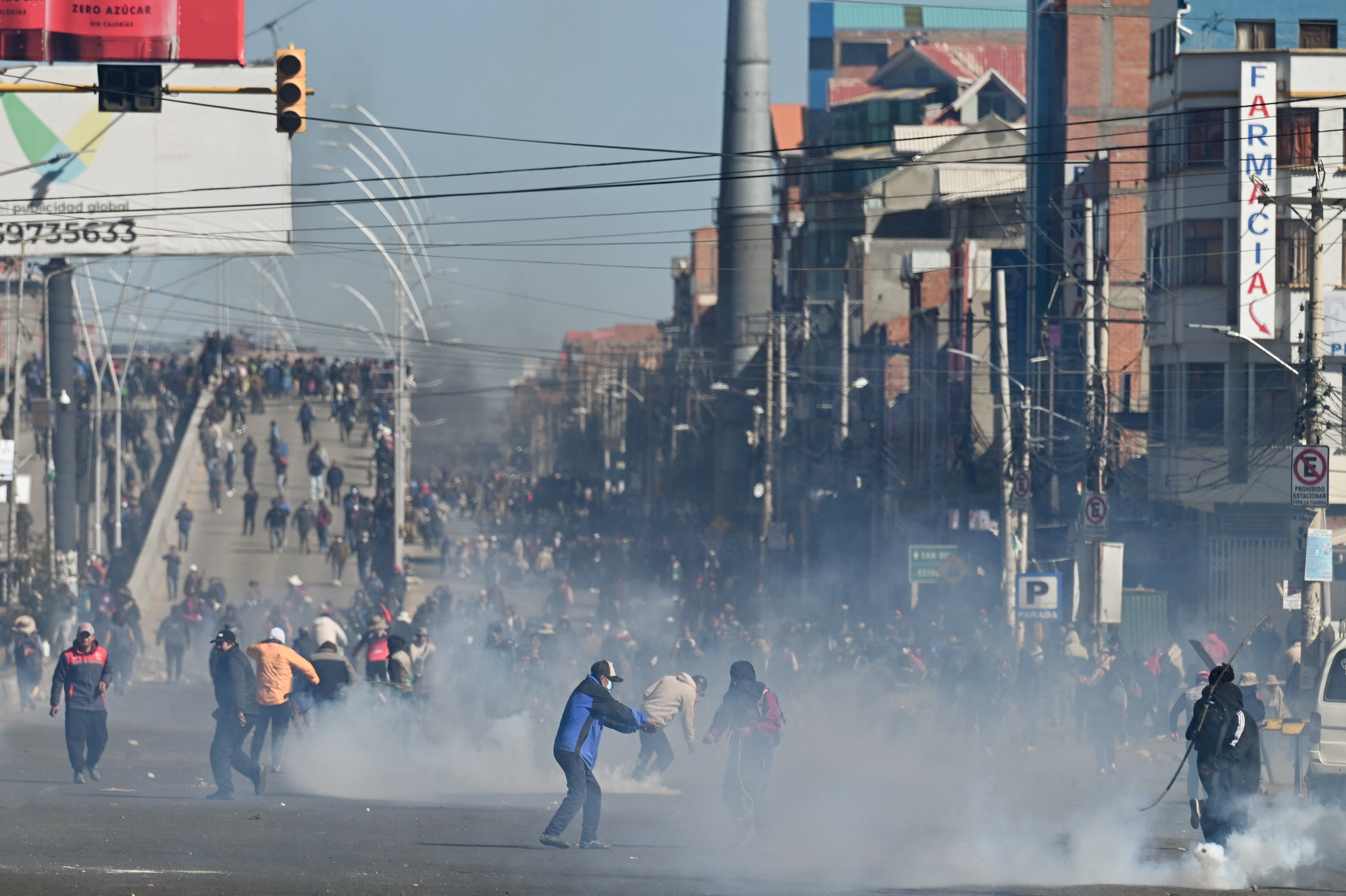 Demonstrators stand amid tear gas as they protest against President Rodrigo Paz's government amid an ongoing economic and fuel crisis in El Alto, Bolivia, May 16, 2026. REUTERS/Claudia Morales