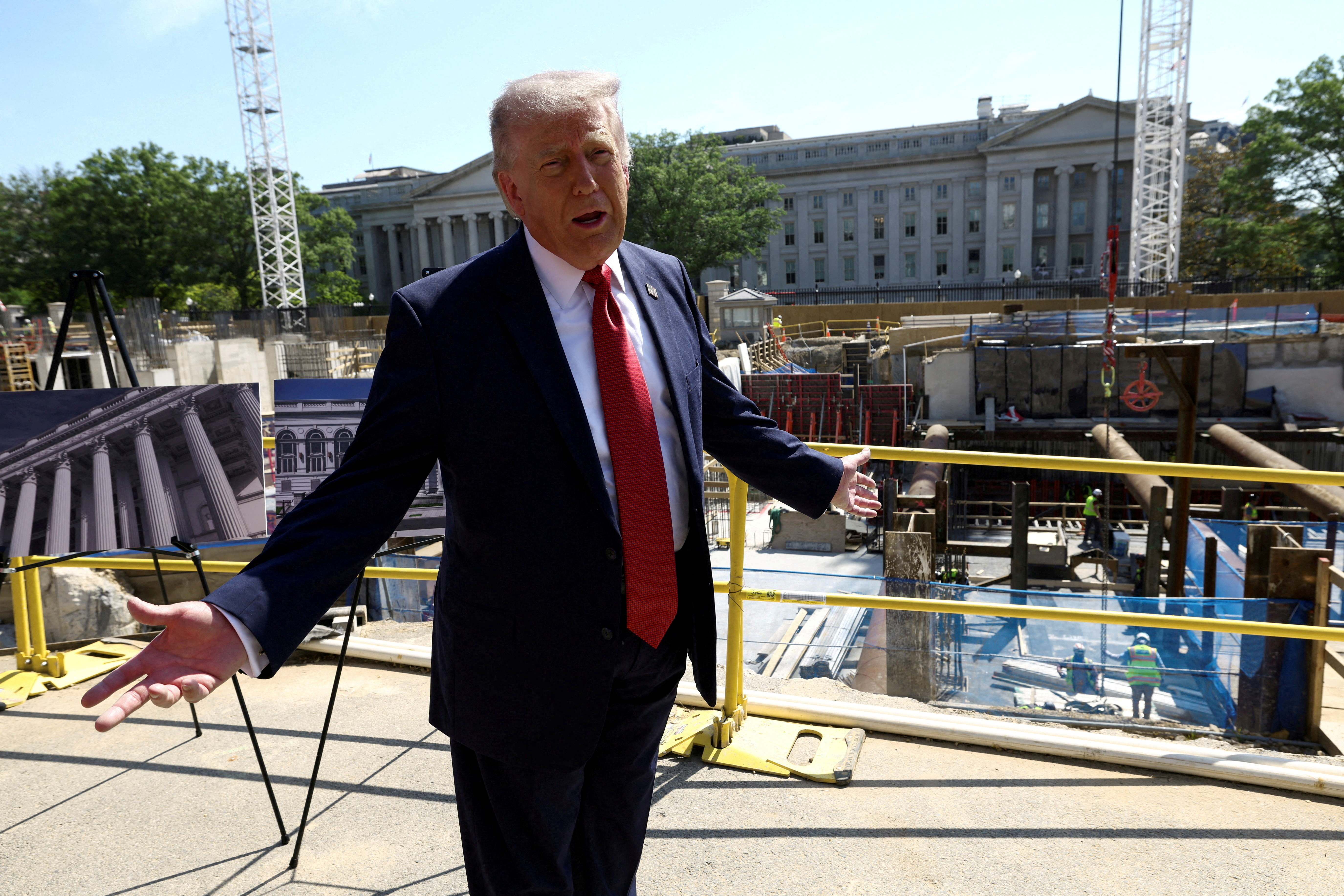 FILE PHOTO: U..S. President Donald Trump gestures at the site of ongoing construction of the planned White House ballroom in Washington, D.C., U.S., May 19, 2026. REUTERS/Kevin Lamarque/File Photo/File Photo
