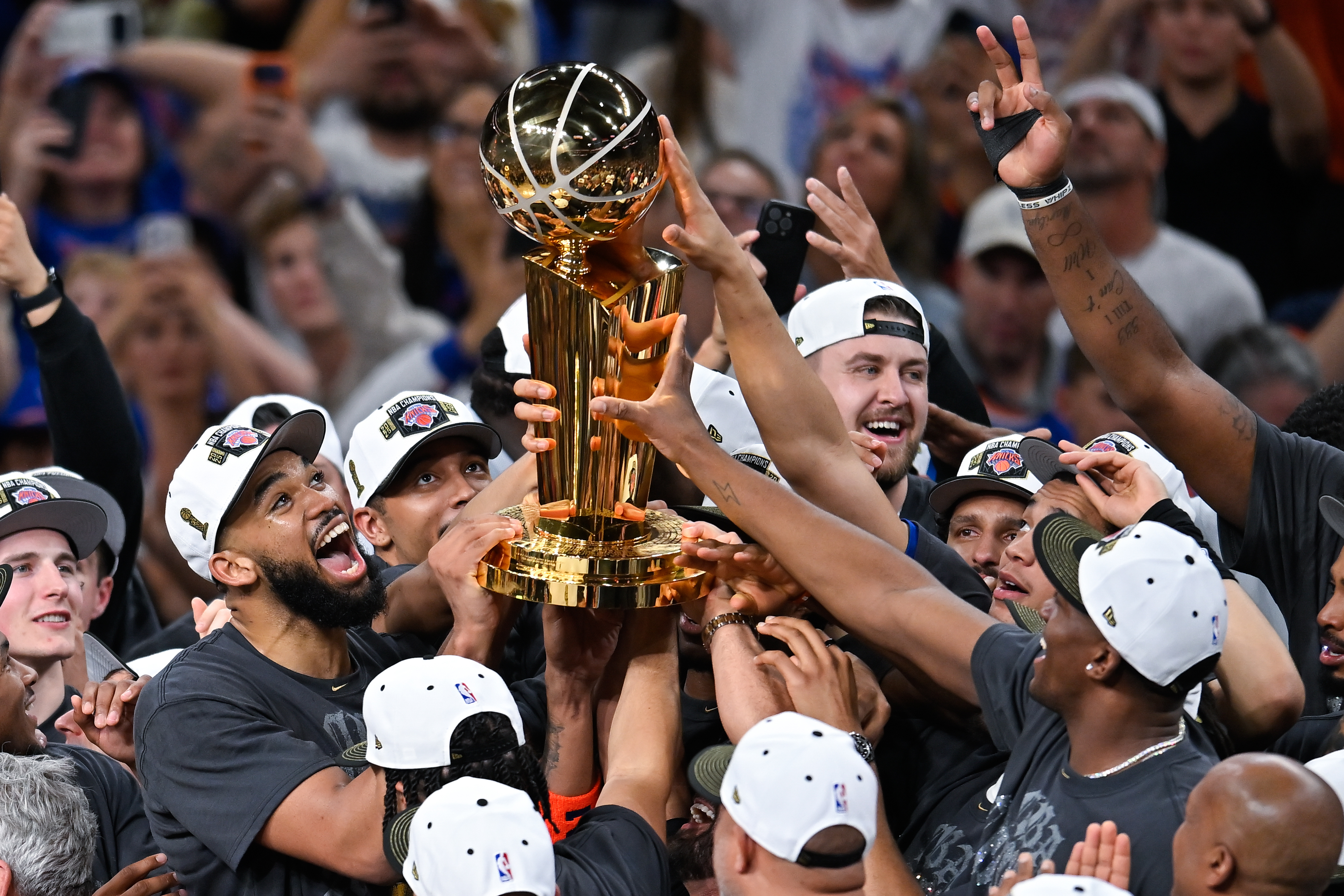 The New York Knicks lift aloft the NBA 2026 trophy after winning the Finals 4-1 [Darren Abate/AP Photo]