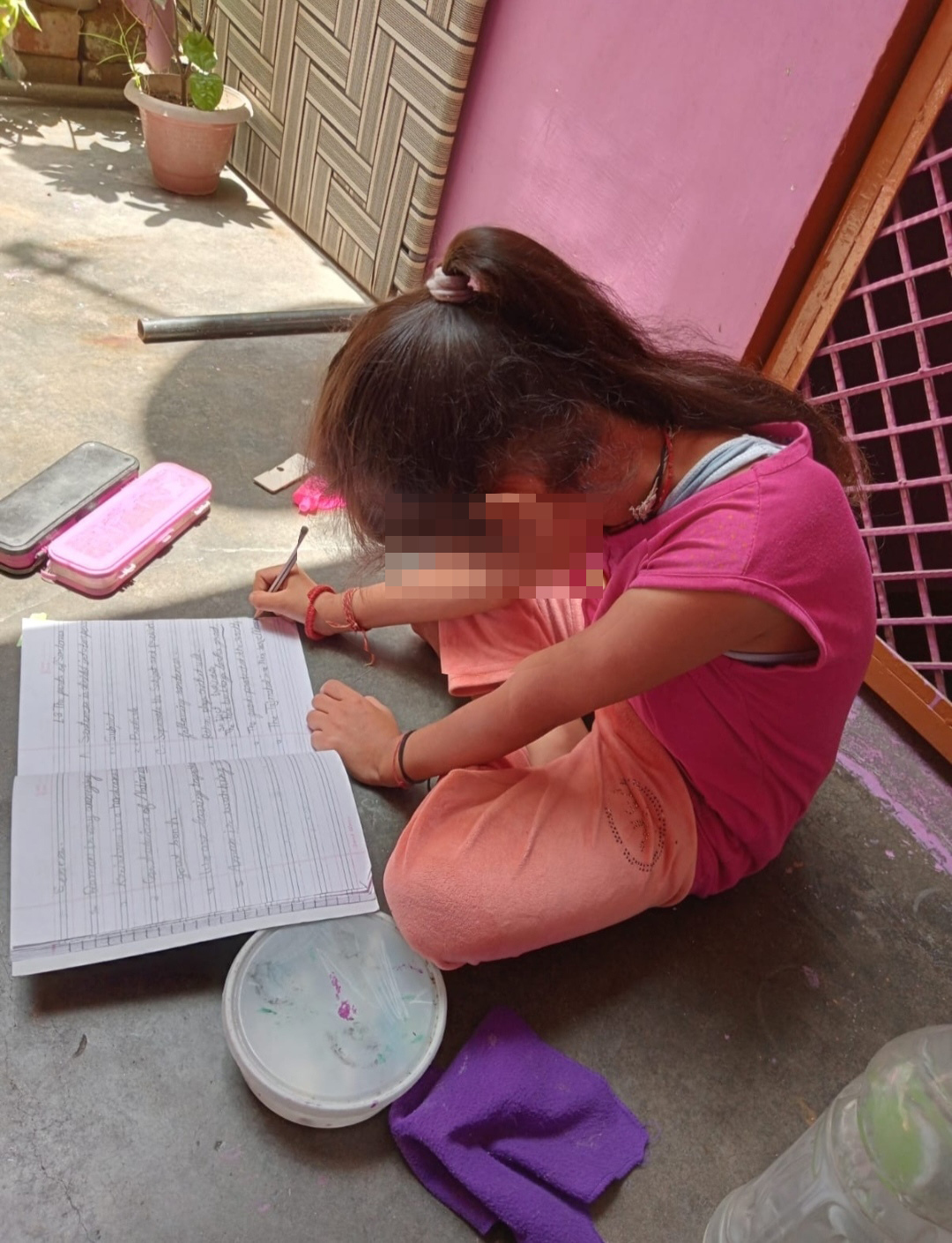 Pia is hard at work studying on the terrace [Courtesy of the family/Al Jazeera]
