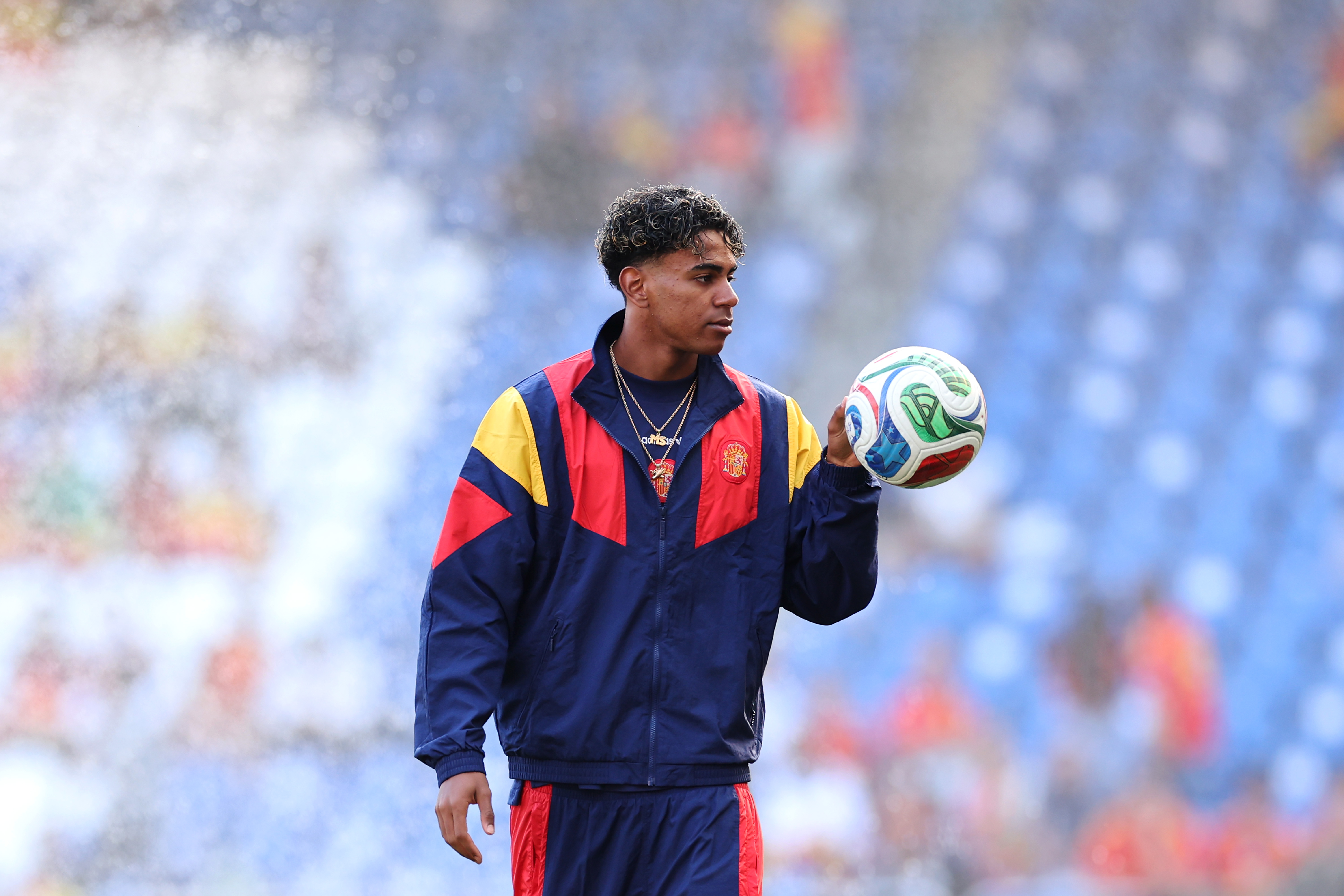 Lamine Yamal of Spain looks on.