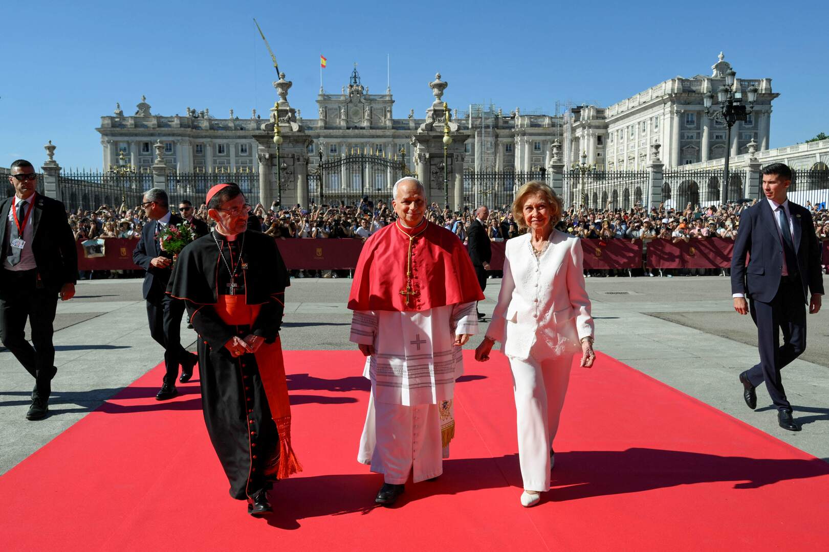 Pope Leo XIV, Spain's former Queen Sofia and Archbishop of Madrid Cardinal Jose Cobo Cano, walk as they visit the Almudena Cathedral in Madrid, Spain, June 8, 2026. Simone Risoluti/Vatican Media/­Handout