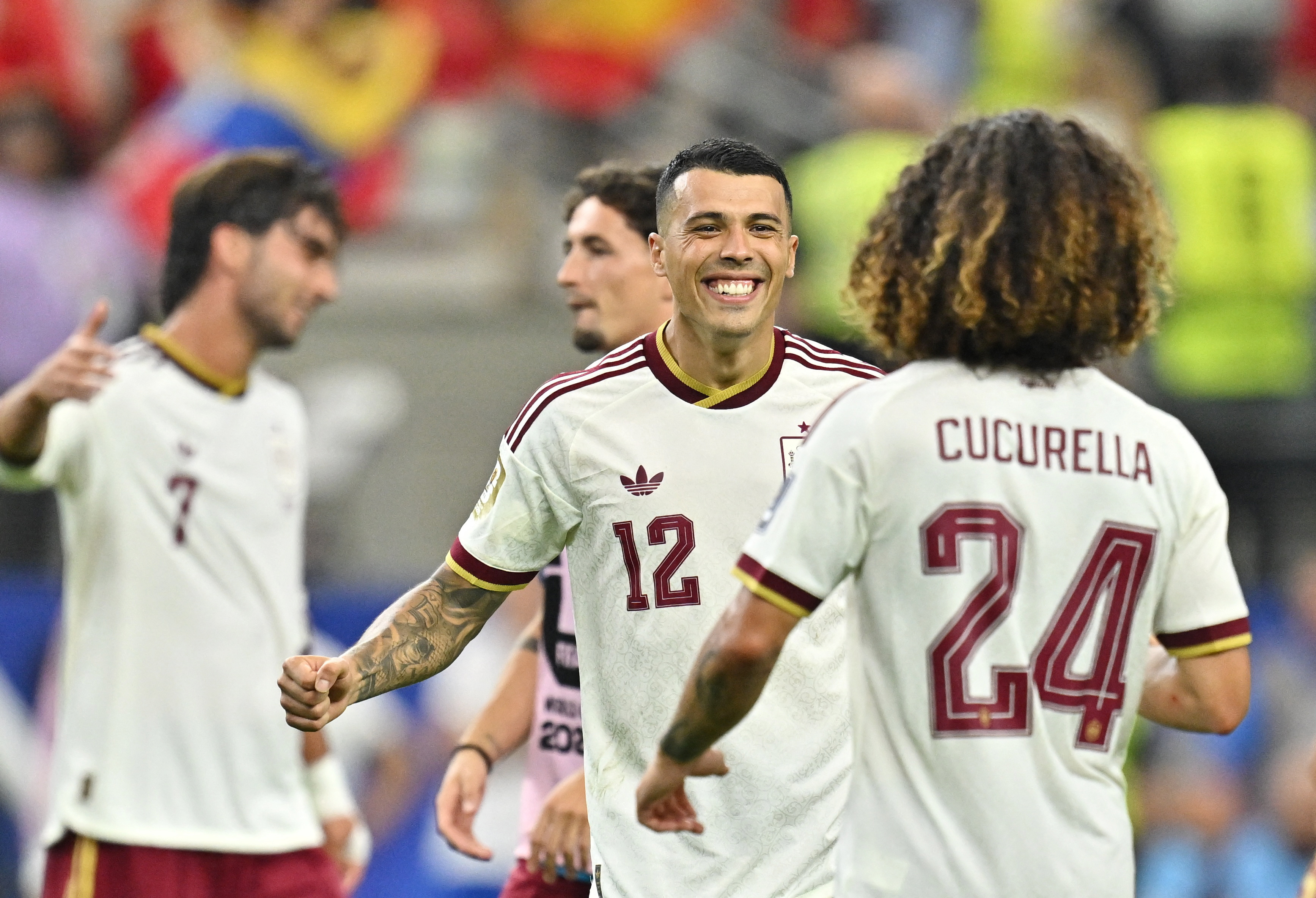 Pedro Porro and Marc Cucurella celebrate after the match.