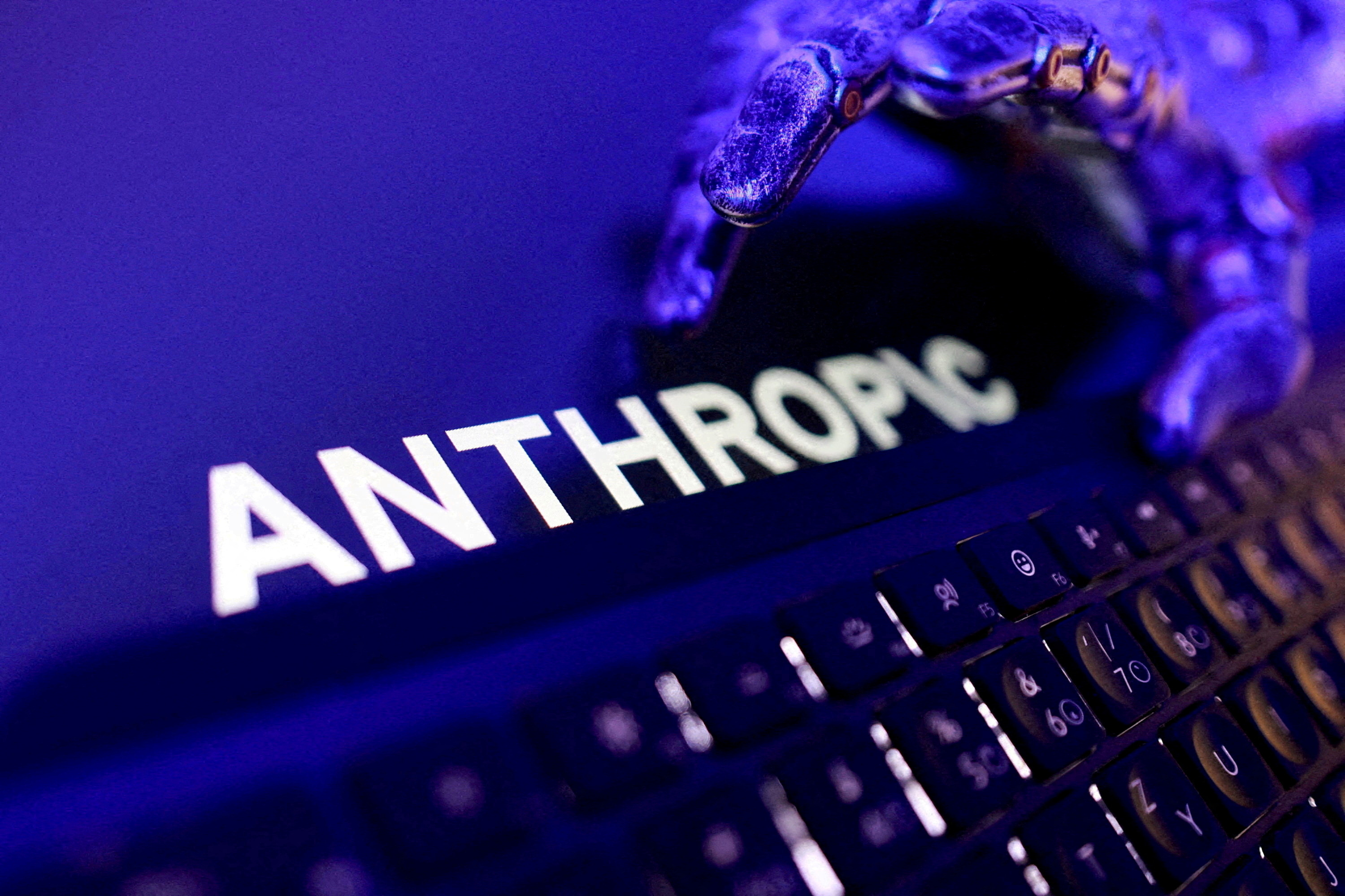 FILE PHOTO: Anthropic logo, a keyboard, and a robotic hand in this illustration created on June 5, 2026. [Dado Ruvic/Reuters]