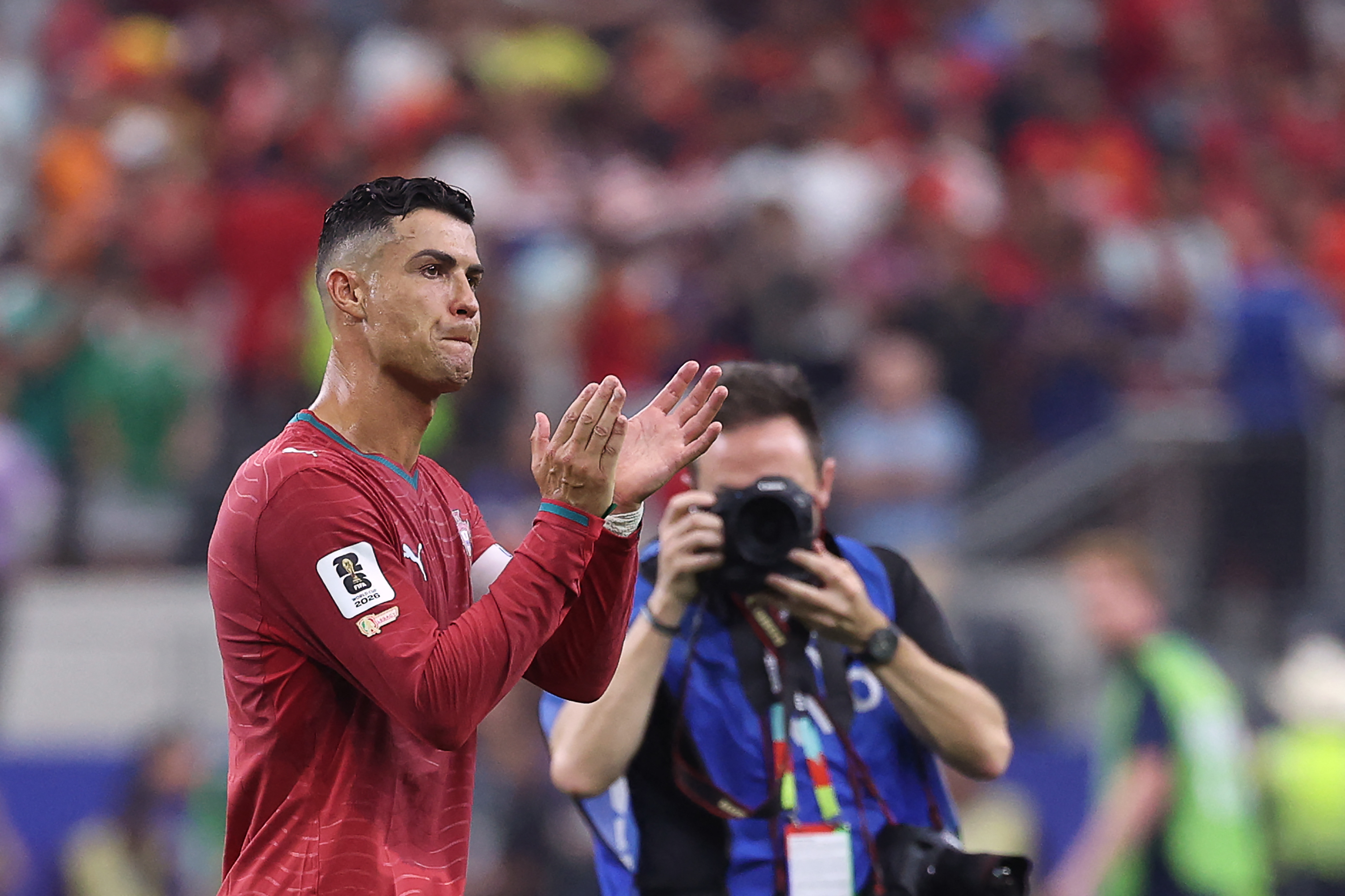 Portugal's forward #07 Cristiano Ronaldo greets fans after losing the 2026 World Cup round of 16 football match between Portugal and Spain at the Dallas Stadium in Arlington on July 6, 2026. (Photo by Thomas COEX / AFP)