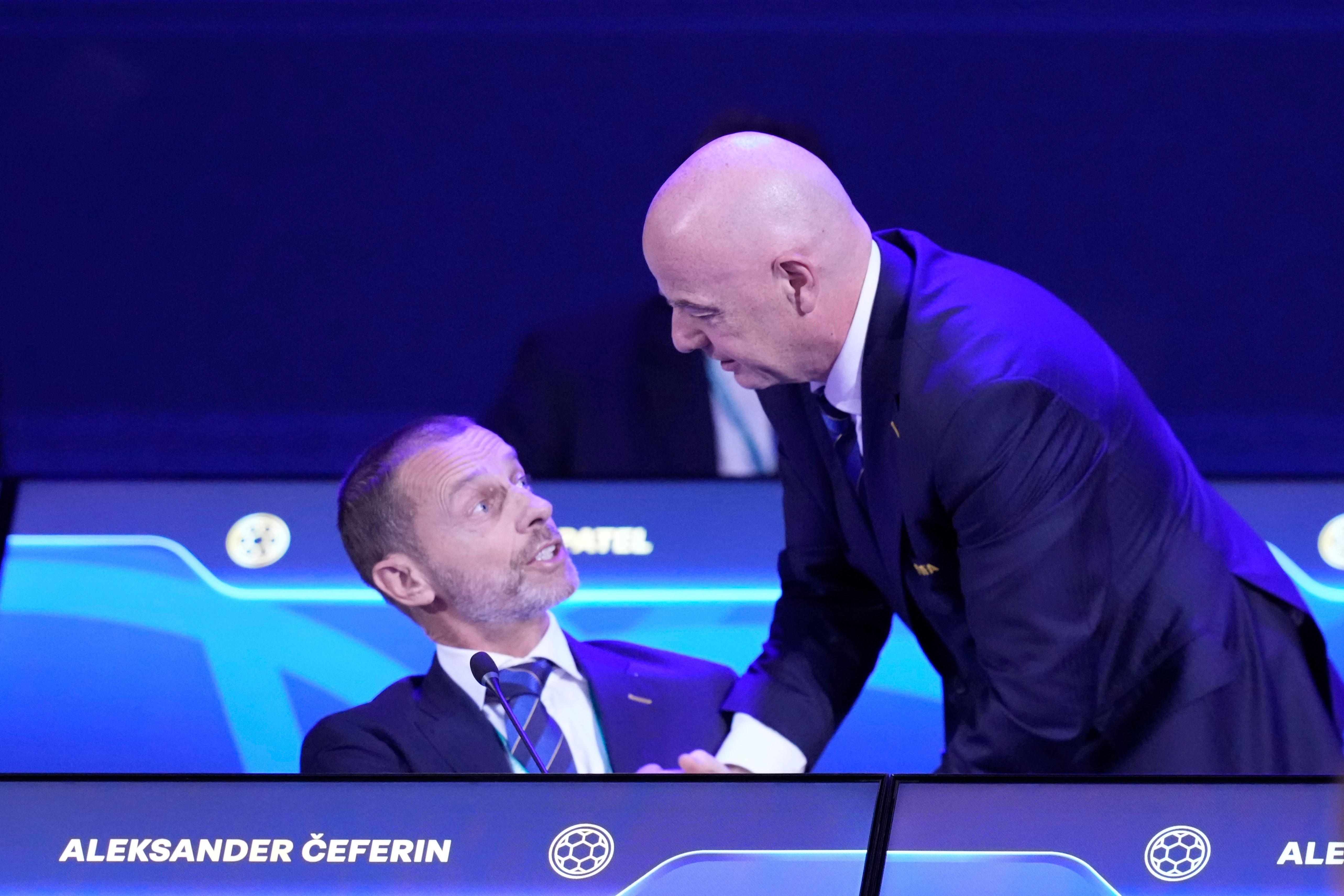 FIFA President Gianni Infantino, right, talks to UEFA President Aleksander Ceferin