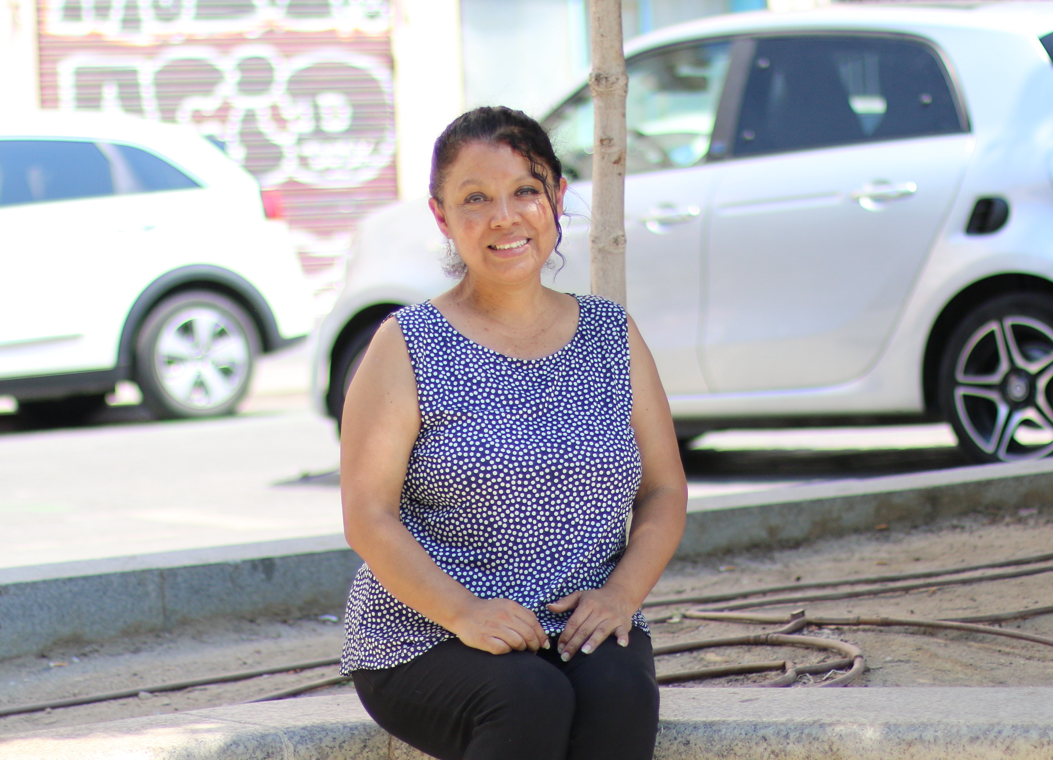Rocio Neciosupe, originally from Peru, outside one of the buildings in Madrid, Spain, where she works as a cleaner