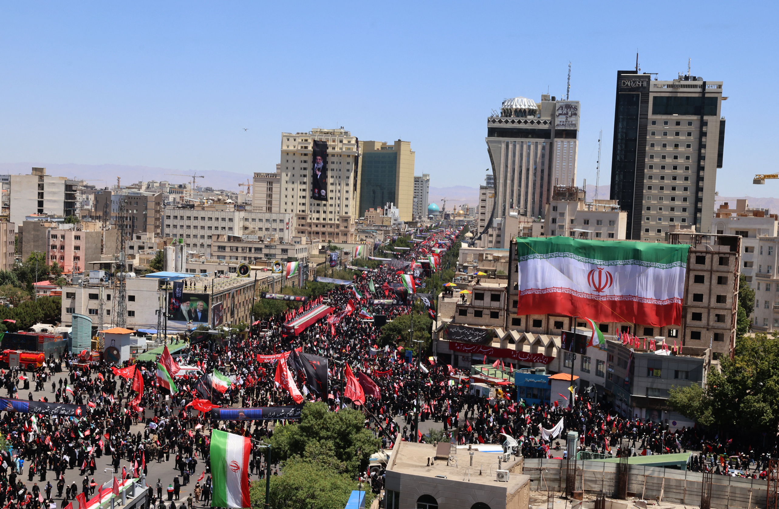 Mourners gather in the street ahead of the funeral of Iran's slain supreme leader Ali Khamenei and members of his family at the Shrine of Imam Reza, Iran's most revered place of worship, in Mashhad on July 9, 2026.