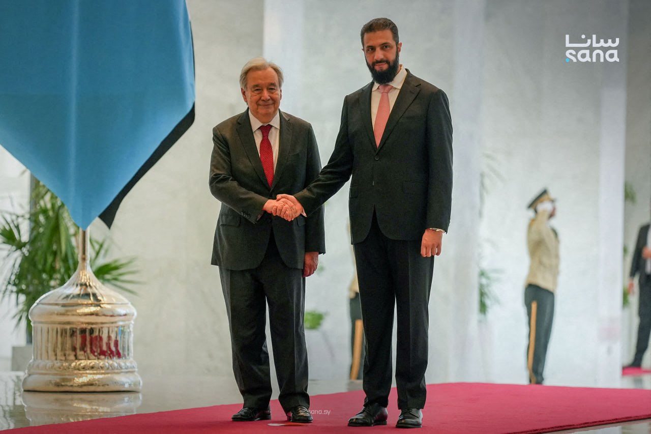 This handout picture taken and released by the official Syrian Arab News Agency (SANA) on July 25, 2026 shows Syria's President Ahmed al-Sharaa (R) receiving UN Secretary-General Antonio Guterres at the People's Palace in Damascus.
