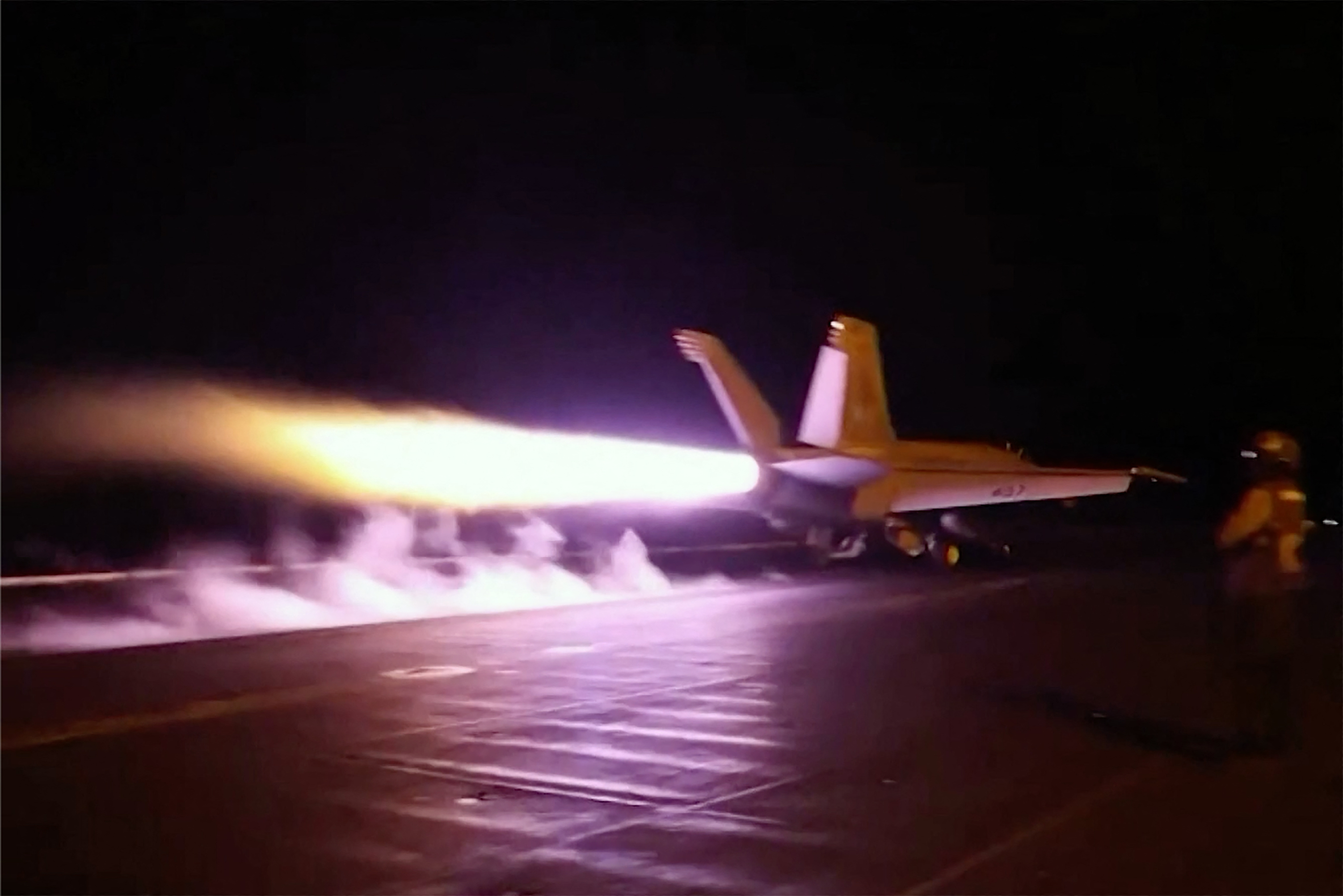 This screen grab made on July 22, 2026 from handout video footage released by the US Central Command (CENTCOM) on July 21, 2026 shows US forces launching what the military says are precision strikes targeting Iranian military capabilities for the eleventh consecutive night.