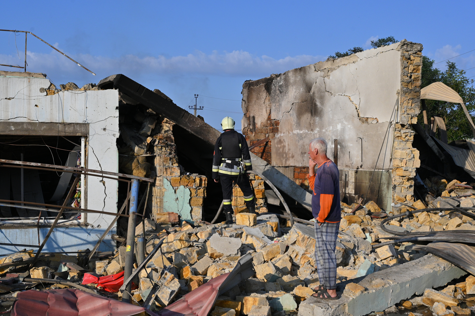 A resident looks at the destruction following a Russian missile attack in Odesa, Ukraine, Friday, July 17, 2026. (AP Photo/Michael Shtekel)