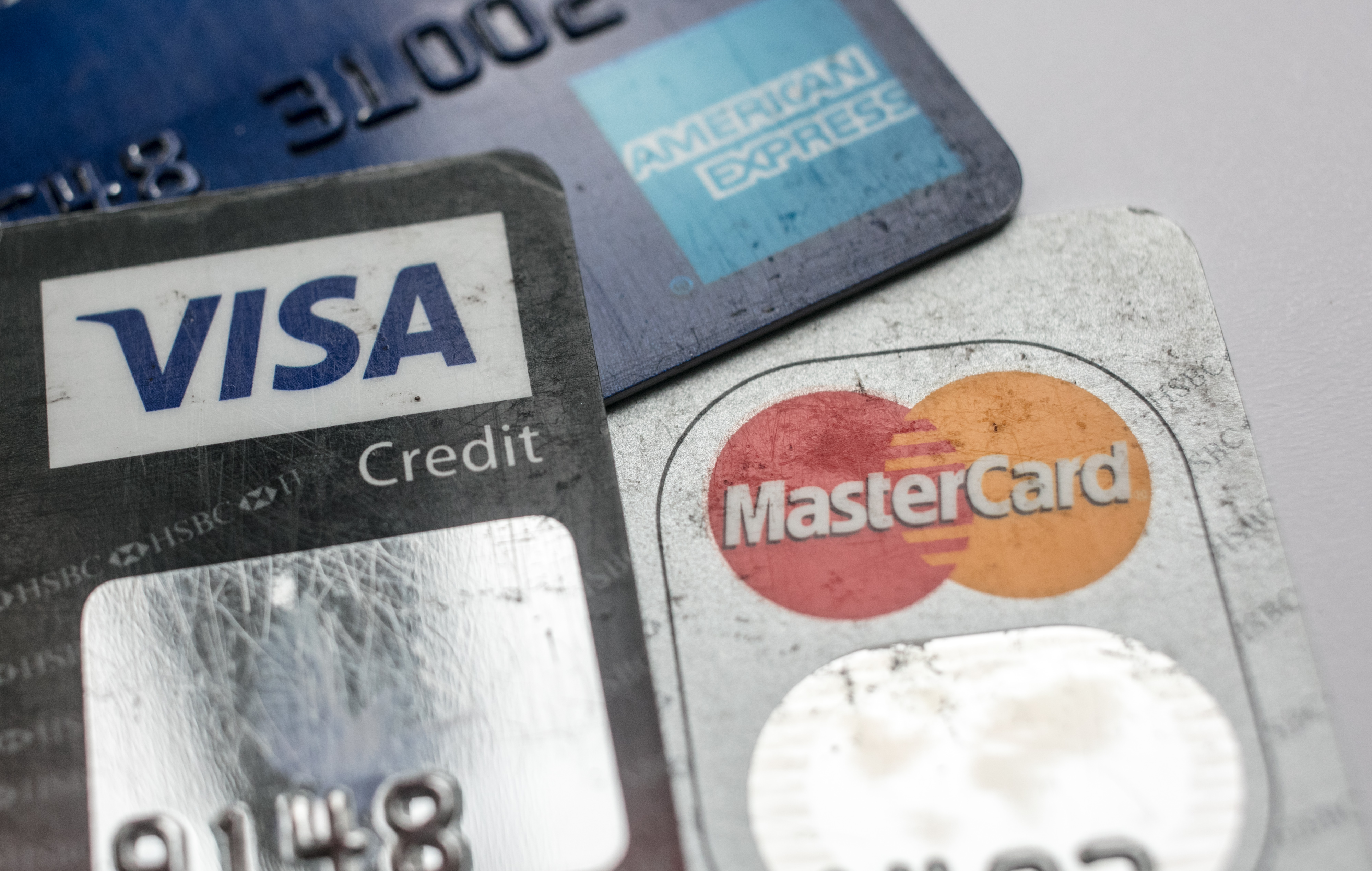 BRISTOL, ENGLAND - NOVEMBER 03: In this photo illustration credit debit cards are seen on November 3, 2017 in Bristol, England. The Bank of England raised interest rates from a historic low for the first time in ten years this week raising costs of lending and concerns for householder debt. (Photo by Matt Cardy/Getty Images)