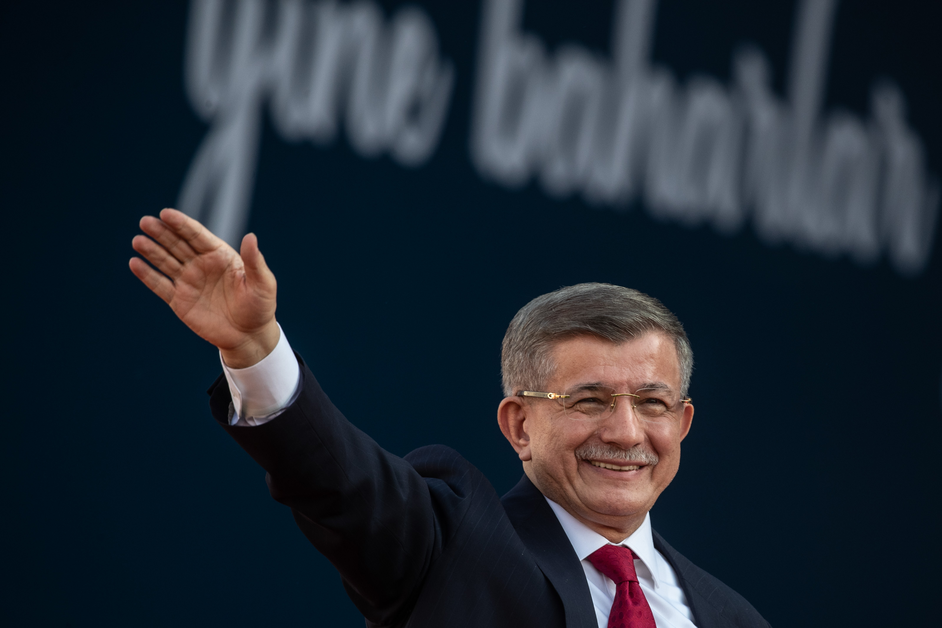 IZMIR, TURKEY - APRIL 30: Former Prime Miniser and Ahmet Davutoglu, and the vice presidential candidate of the Main Opposition alliance, greets to supporters at a rally while campaigning for the presidential election on April 30, 2023 in Izmir, Turkey. CHP leader Kemal Kilicdaroglu is holding campaign rallies across Turkey ahead of the countries May 14, 2023 presidential and parliamentary elections. The Kilicdaroglu-led Nation Alliance is representing six opposition parties in next month's election against President Recep Tayyip Erdogan's 20-year rule. (Photo by Burak Kara/Getty Images)