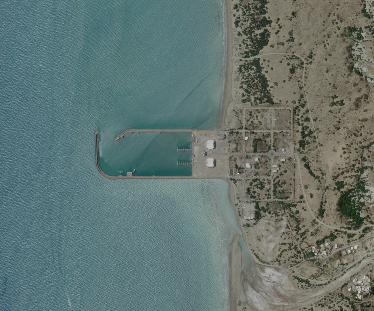 Satellite imagery shows an Iranian port building before the recent U.S. strikes in Sarkhur Tahruyi, Hormozgan Province, Iran, July 7, 2026. 2026 [Planet Labs PBC/Handout/Reuters]