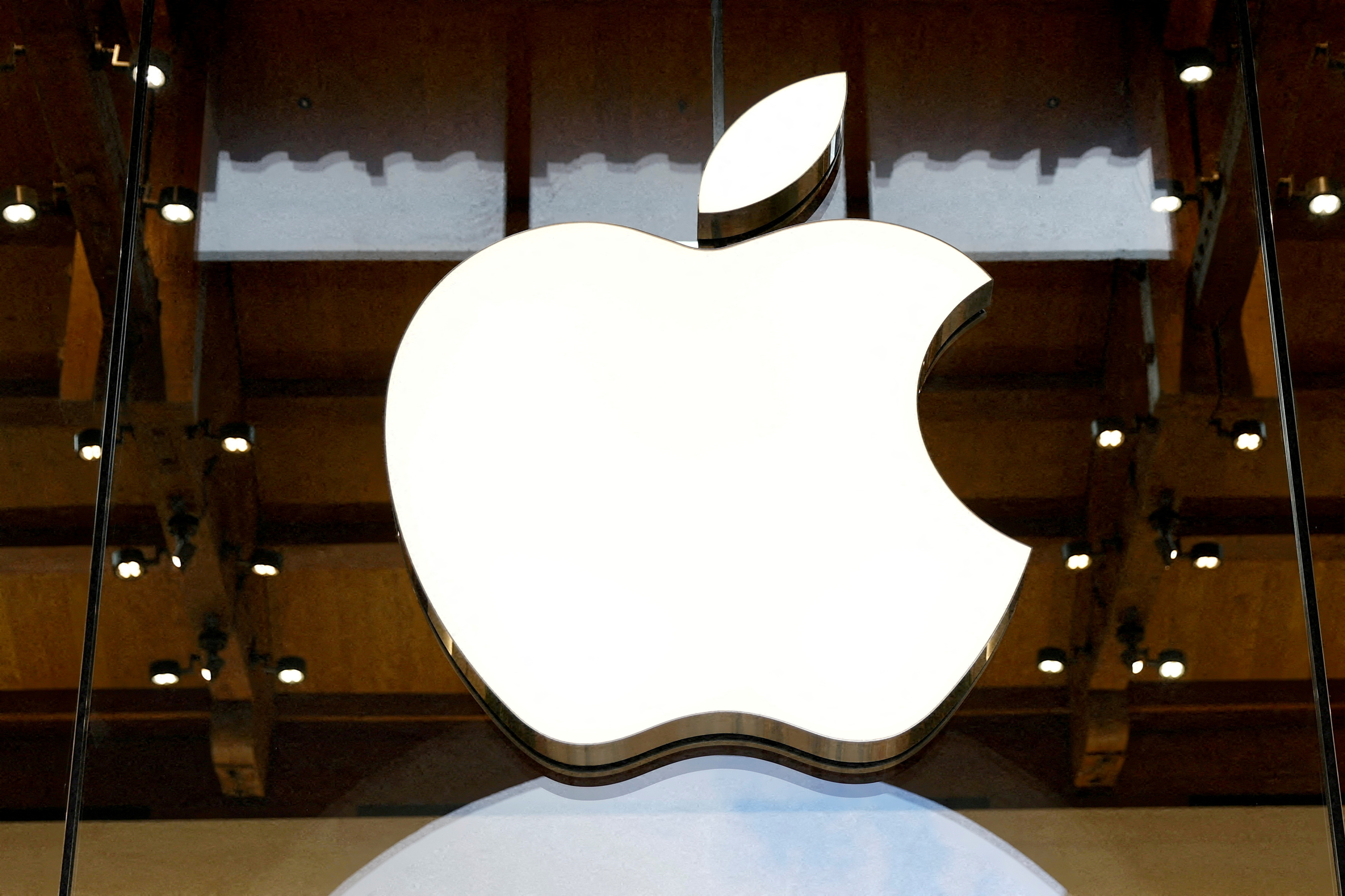 FILE PHOTO: View of an Apple logo at an Apple store in Paris, France, April 23, 2025. REUTERS/Abdul Saboor/File Photo