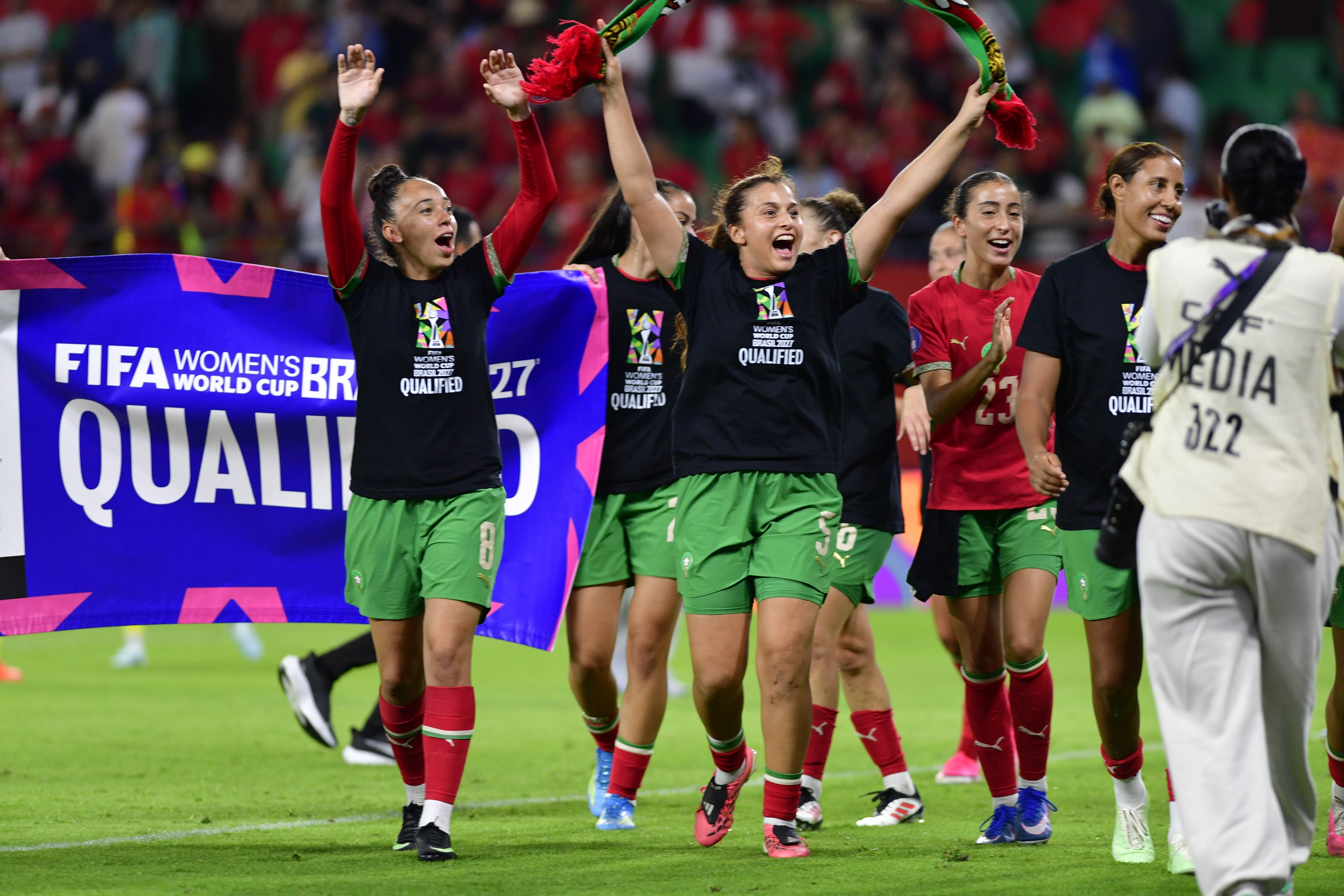 Morocco players hold a FIFA World Cup 2027 banner after defeating South Africa