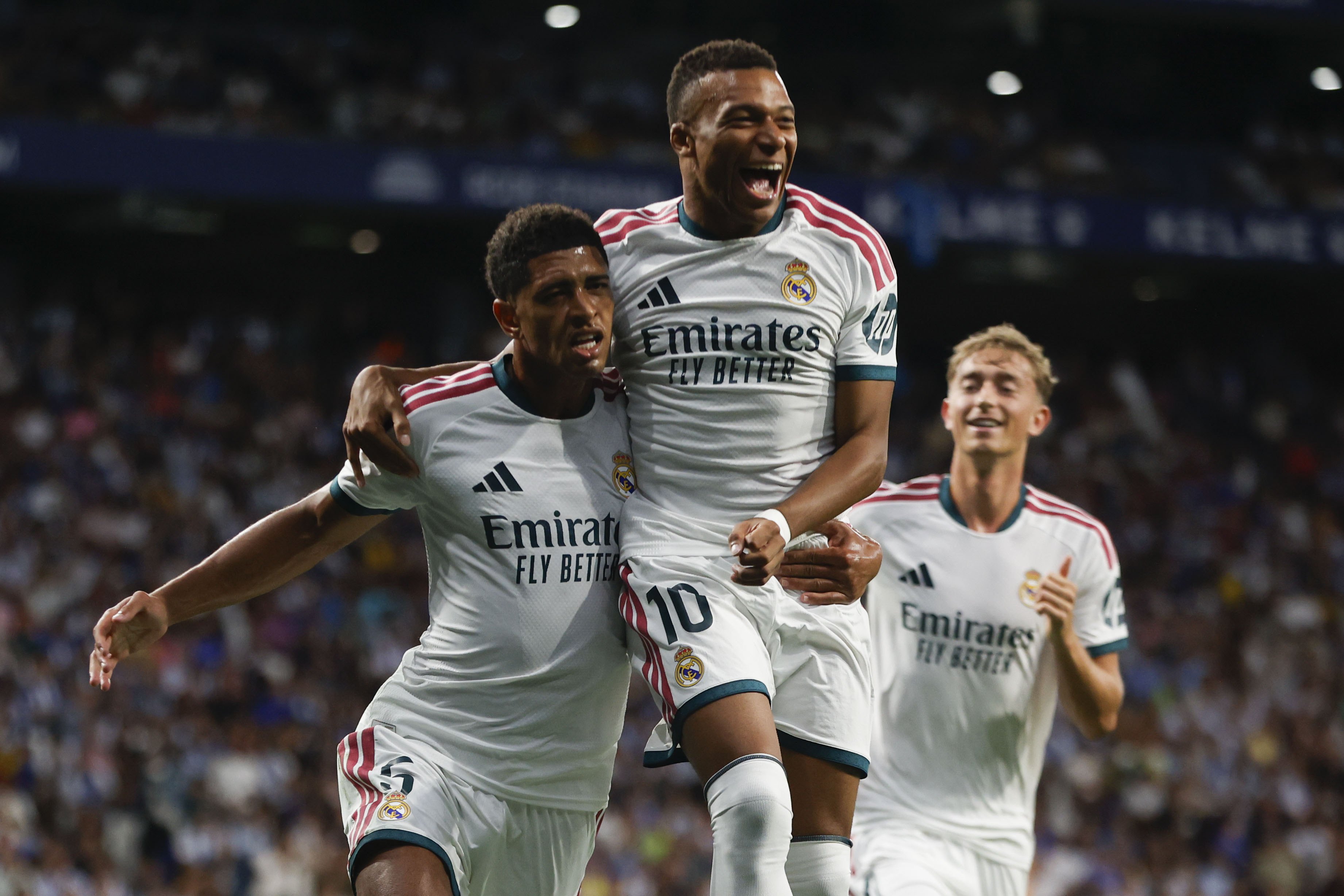 Real Madrid's Jude Bellingham, left, celebrates with teammate Kylian Mbappe after scoring in the win at Espanyol [Quique Garcia/EPA]