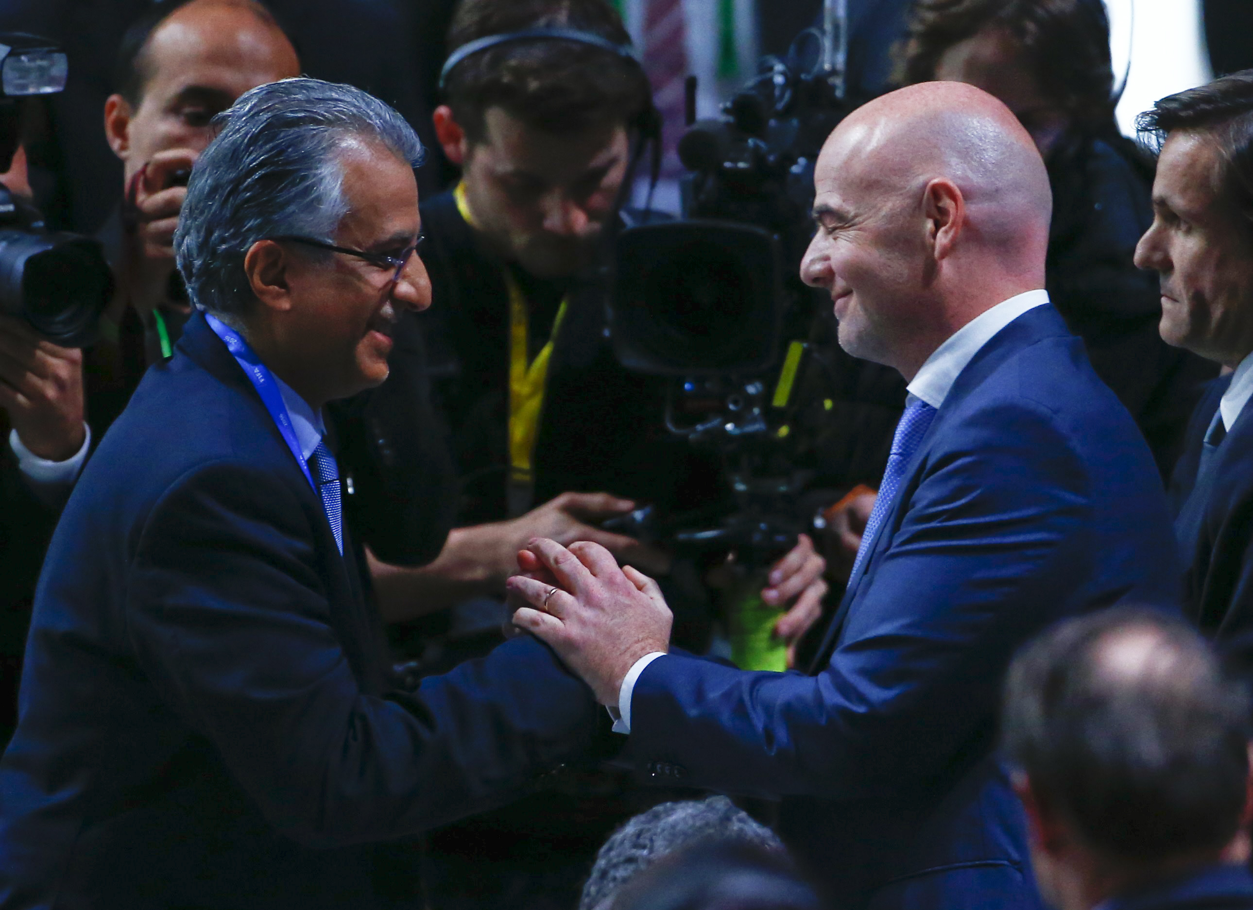 FIFA presidential candidate Sheikh Salman Bin Ebrahim Al-Khalifa of Bahrain (L) congratulates newly elected FIFA President Gianni Infantino during the Extraordinary Congress in 2016