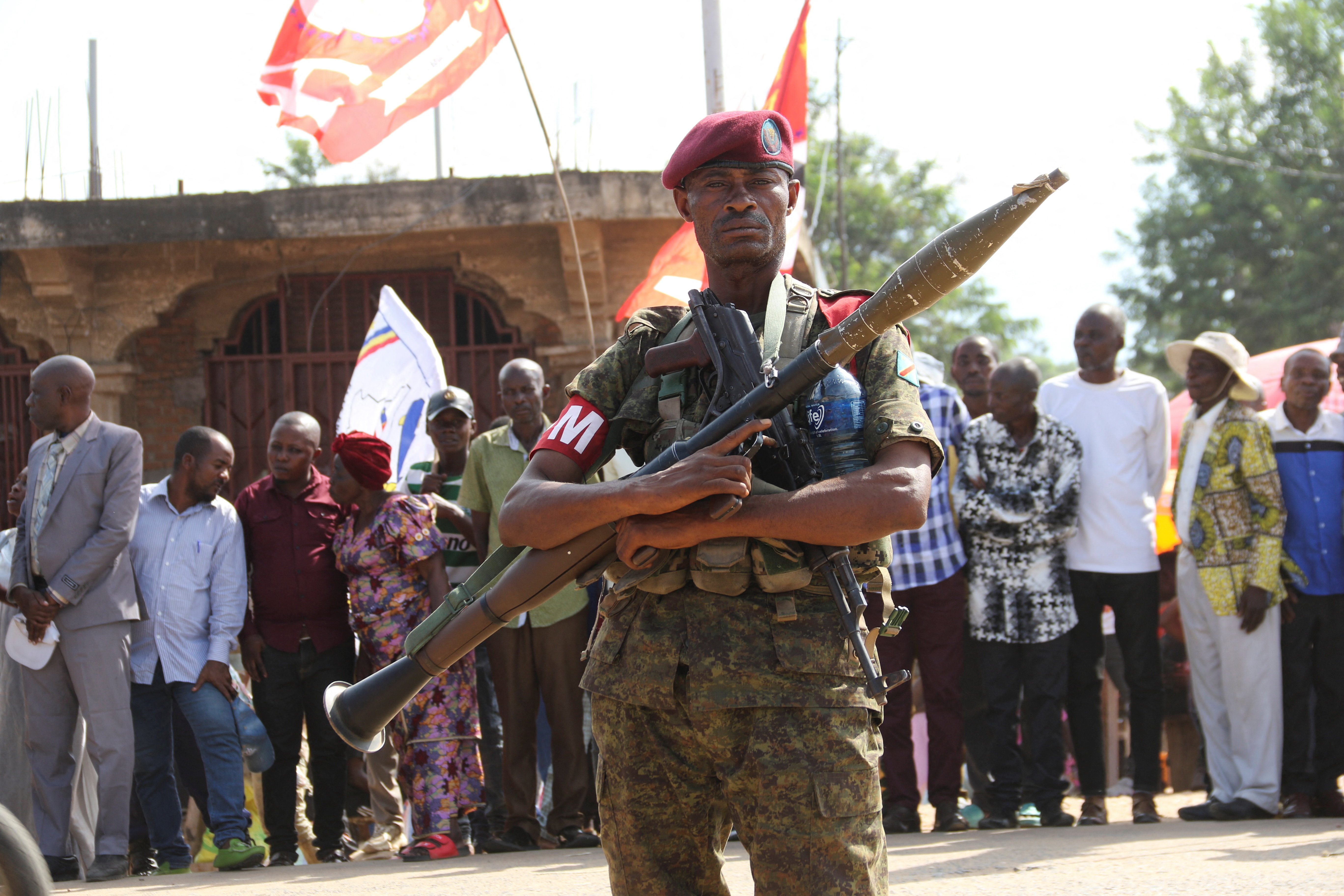 A member of DRC armed forces stands guard along a street in Sange, South Kivu province