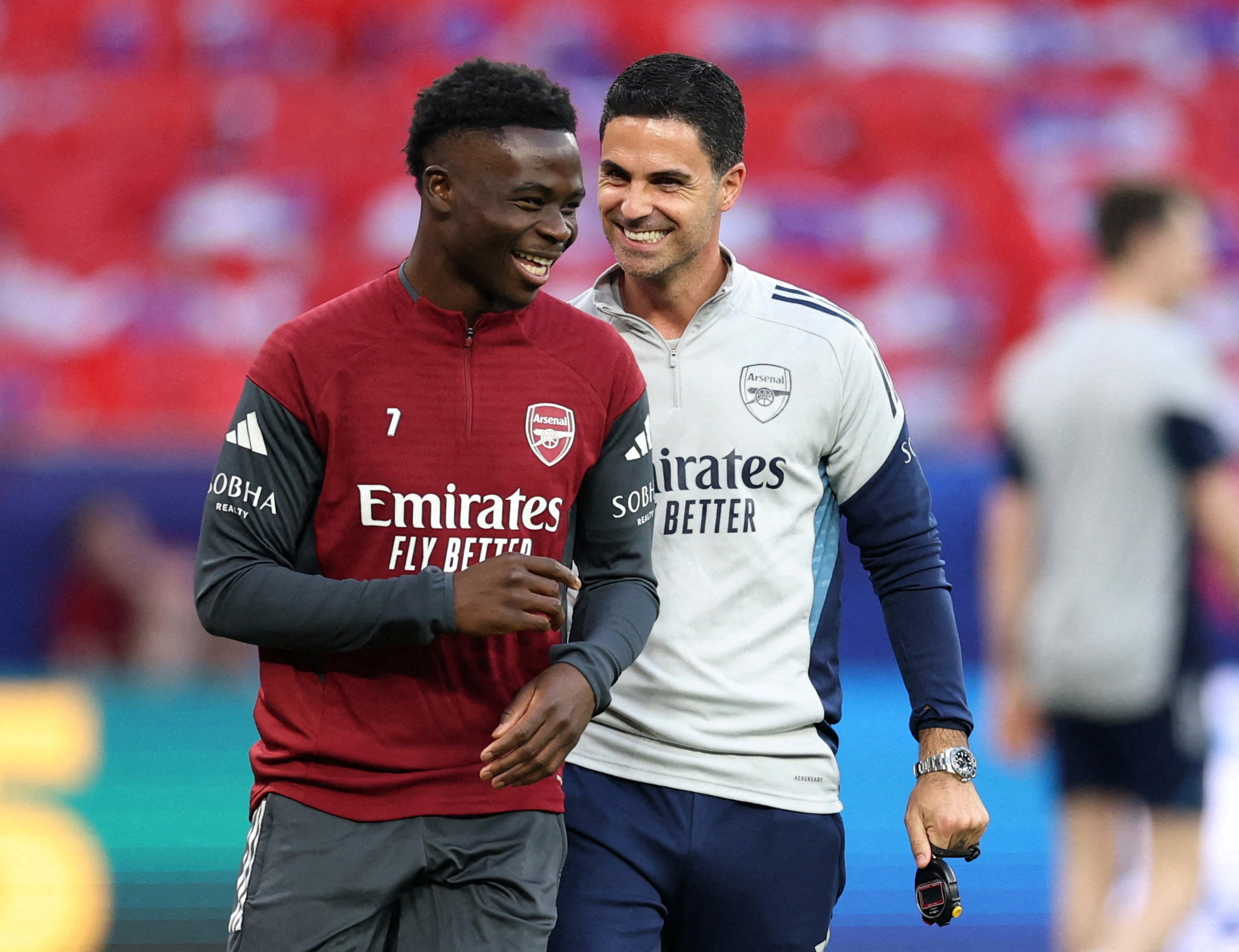 Arsenal's Bukayo Saka and manager Mikel Arteta during training