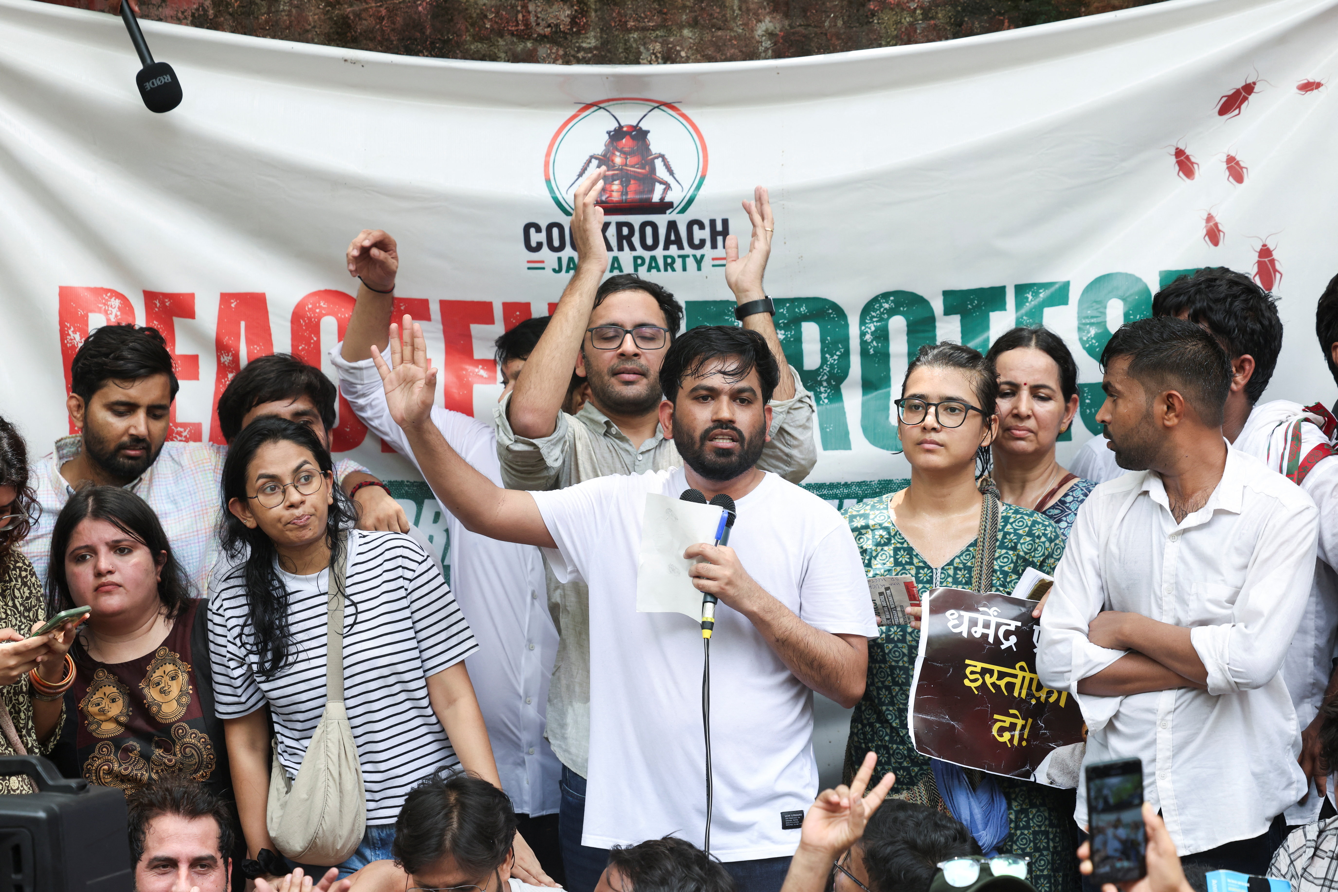 Abhijeet Dipke, head of the Cockroach Janta Party (CJP), stands beside All India Students’ Association national president Neha Bora, right, during a sit-in protest demanding the resignation of Indian Education Minister Dharmendra Pradhan, in New Delhi, India, on June 6, 2026